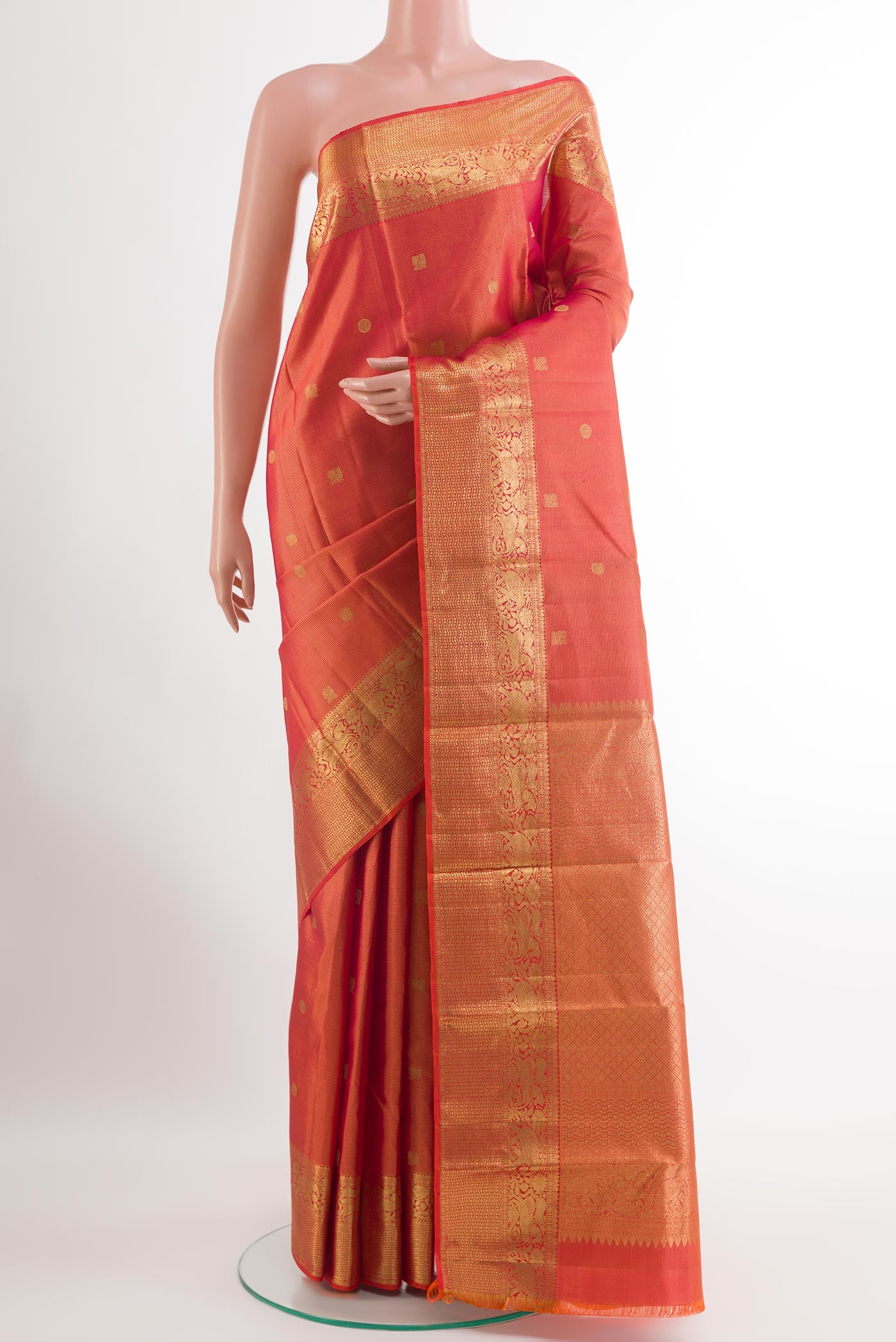 Red Kanjivaram Silk Saree with Zari Brocade on the body and Zari Border.  displayed on a mannequin
