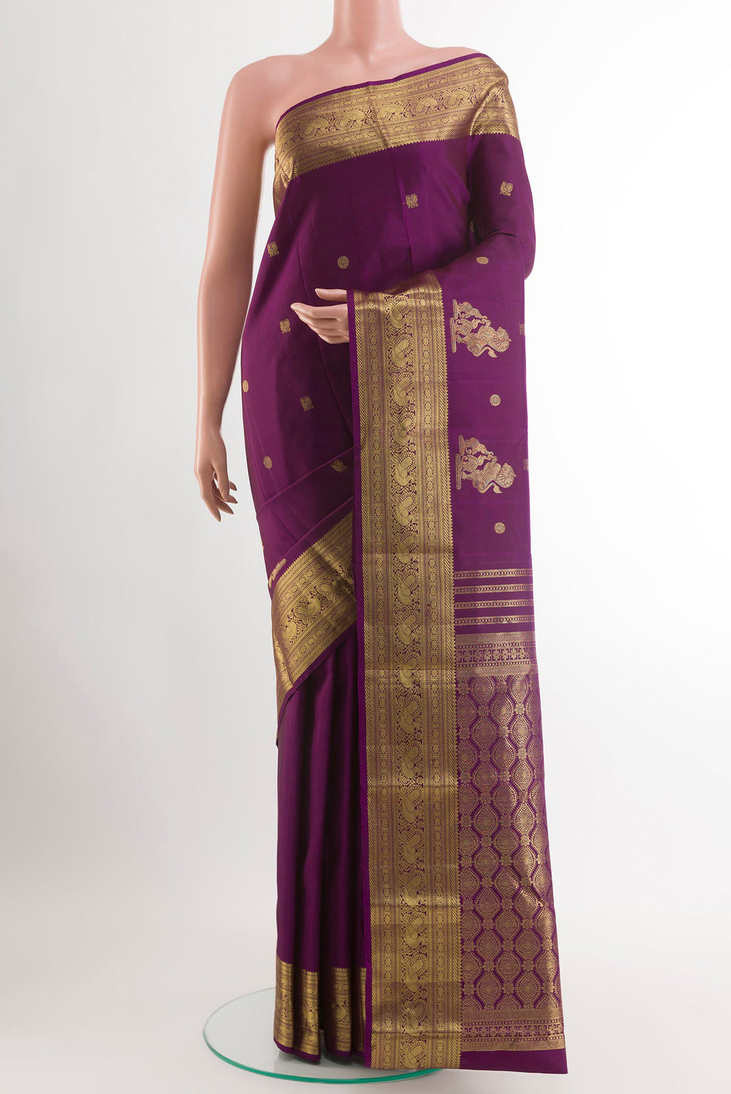 Purple Kanchipuram Silk Saree with Zari Butta on the body and Zari Border.  displayed on a mannequin