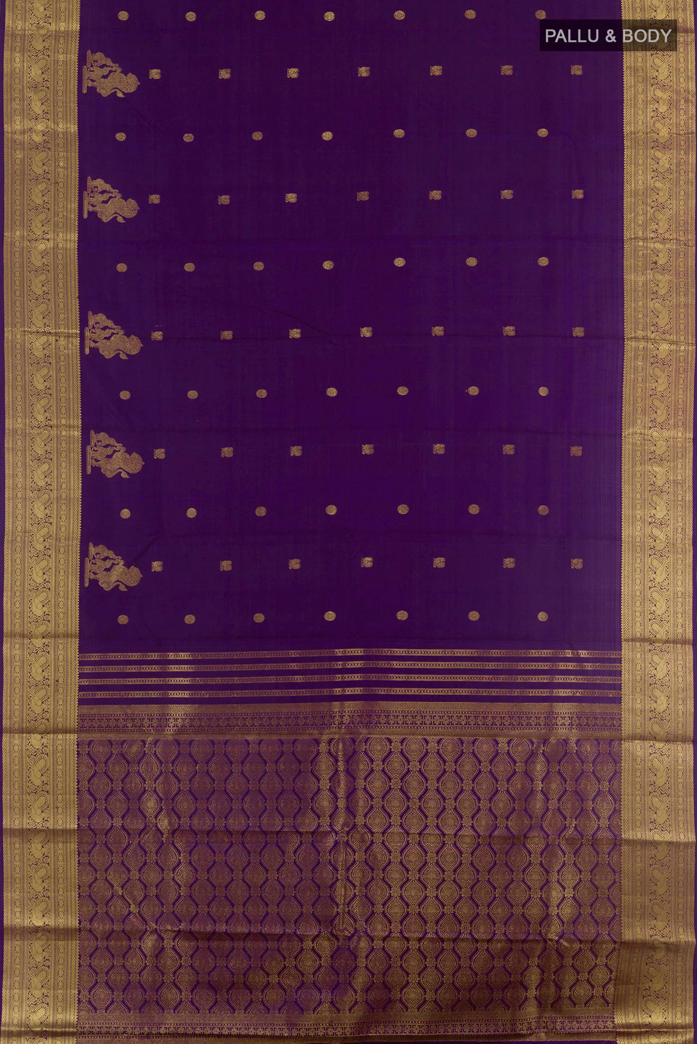 Flat view of Purple Kanchipuram Silk Saree with Zari Butta on the body and Zari Border. 