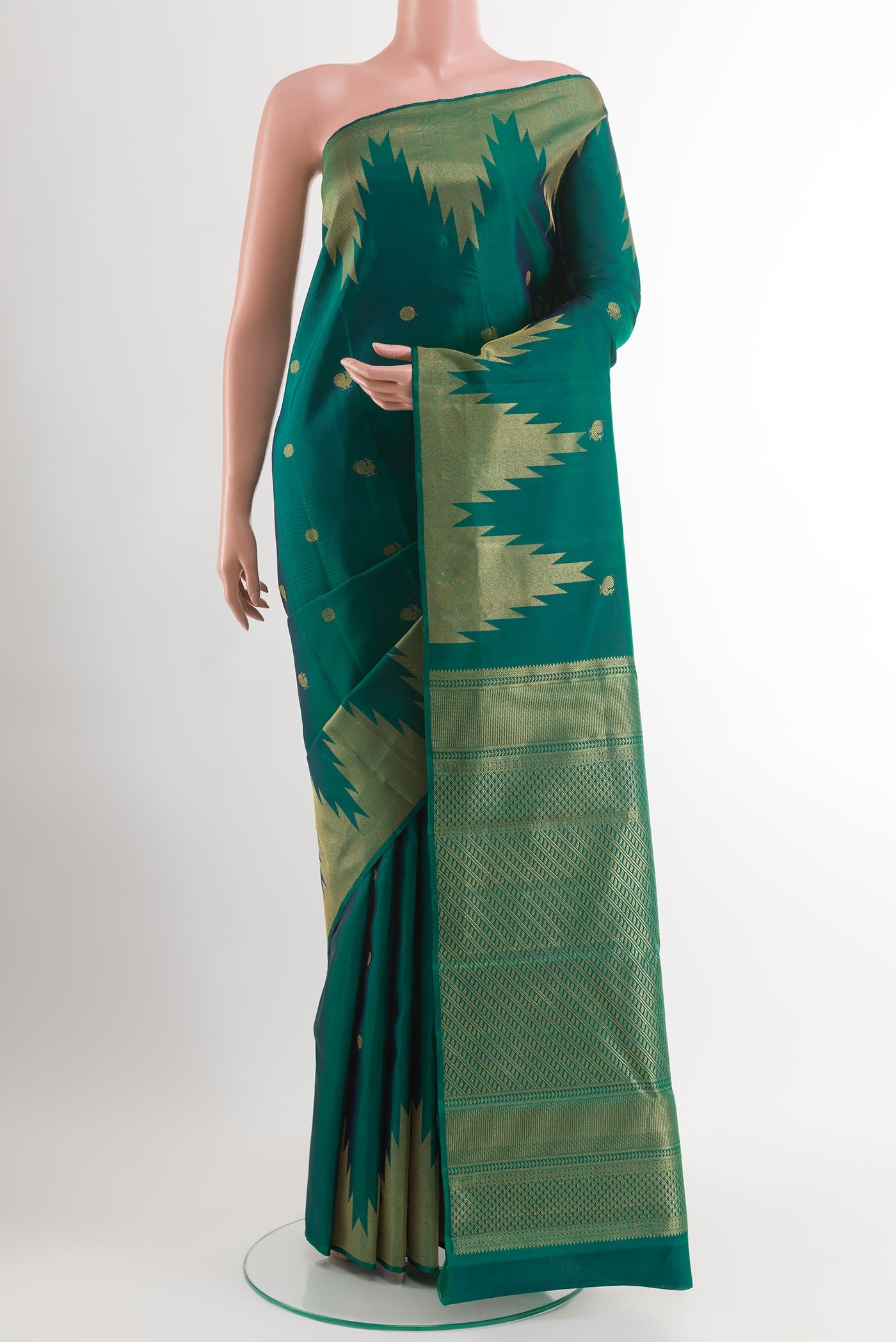 Green Dual Tone Kanjivaram Silk Saree with Zari Butta on the body and Temple Border.  displayed on a mannequin