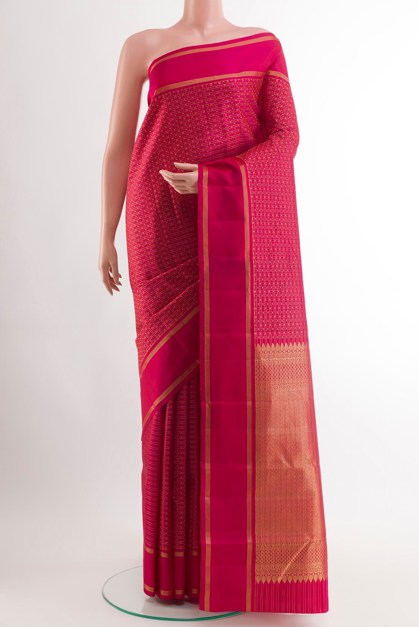Rani Pink Kanjivaram Silk Saree with Zari Brocade on the body and Zari Border.  displayed on a mannequin