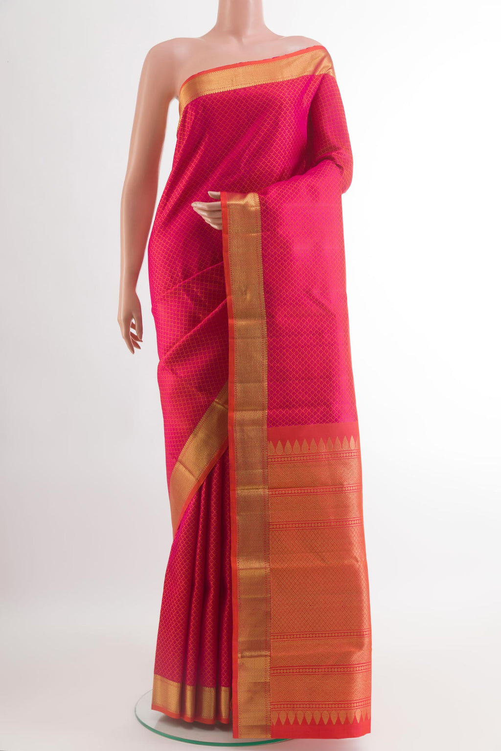 Pink Kanjivaram Silk Saree with Jacquard design on the body and Zari Border.  displayed on a mannequin