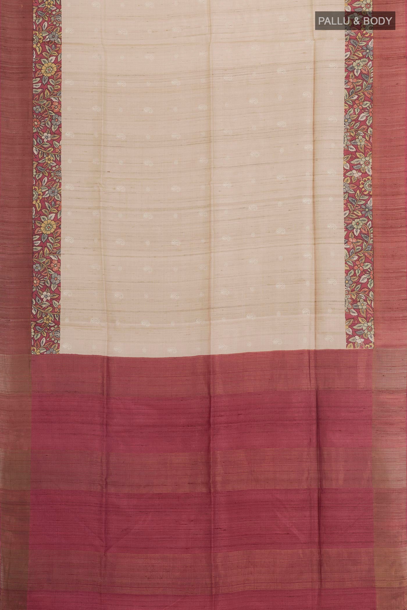 Flat view of Cream Tussar Saree with Thread Butta on the body and Zari Border. 