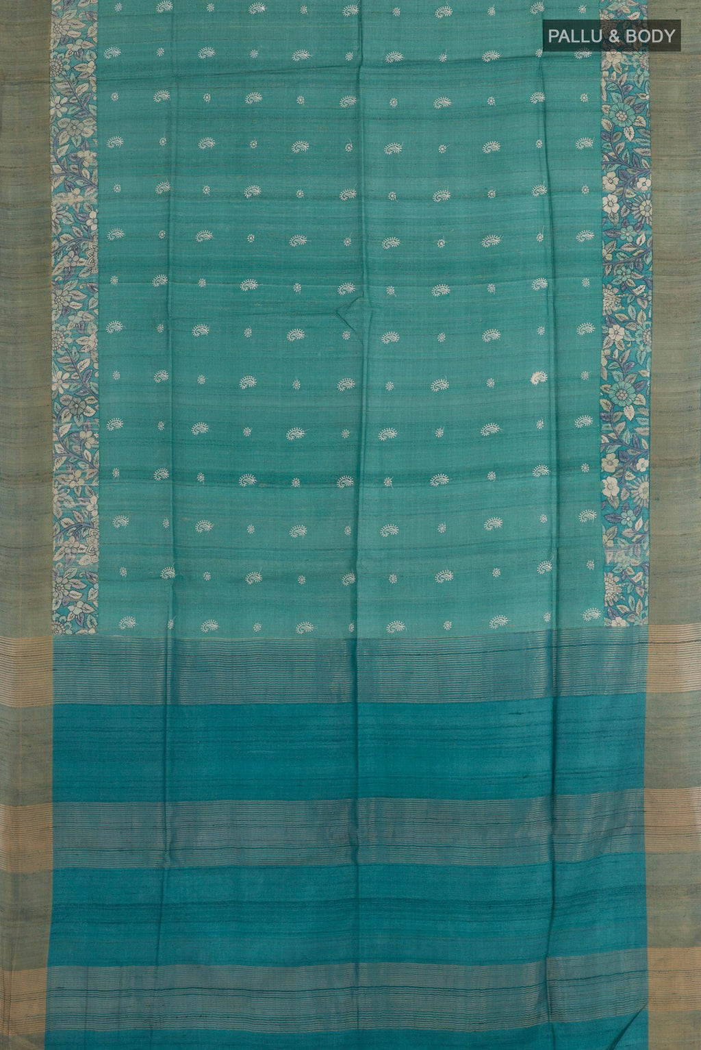 Flat view of Light Blue Tussar Saree with Thread Butta on the body and Zari Border. 