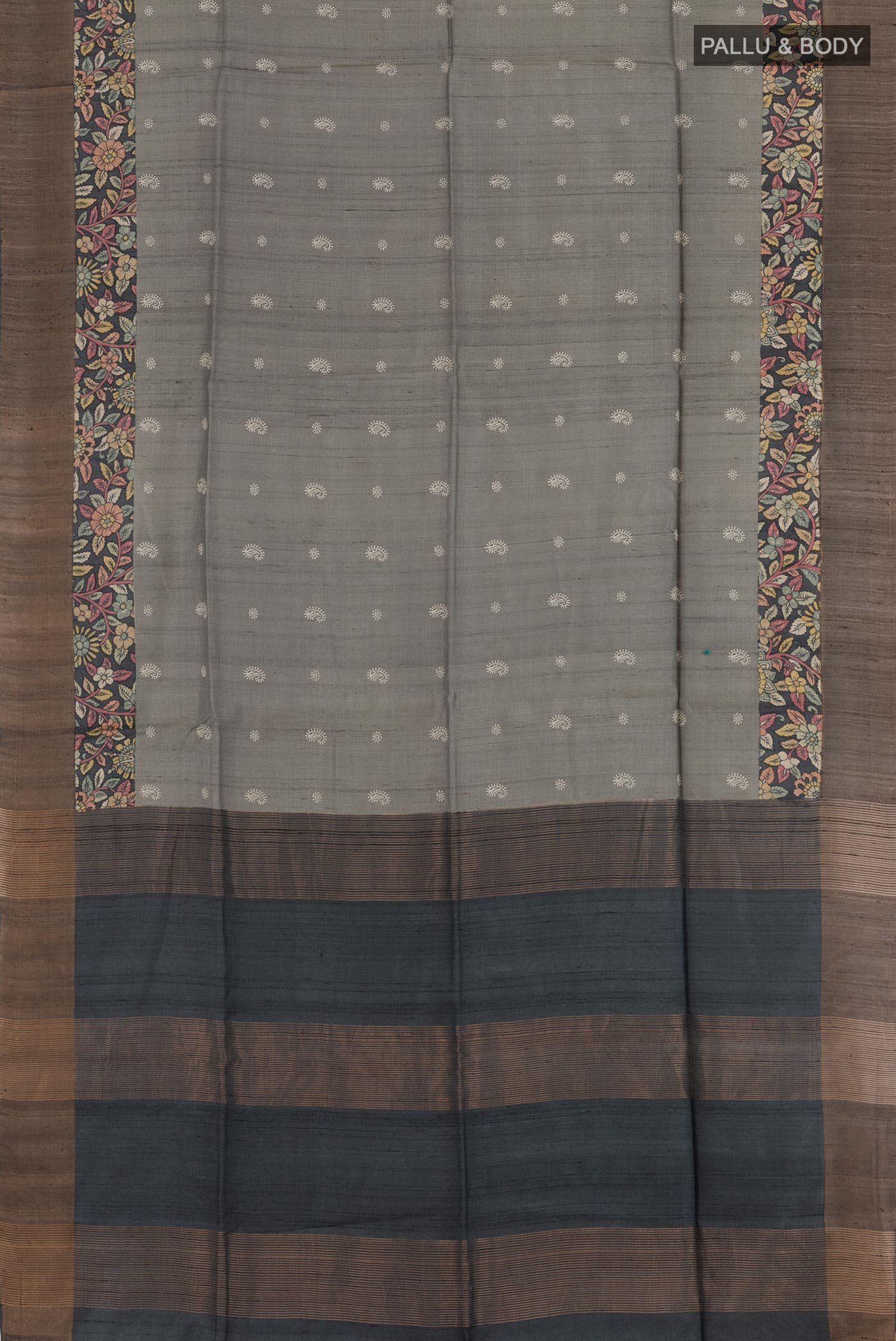 Flat view of Grey Tussar Saree with Thread Butta on the body and Zari Border. 