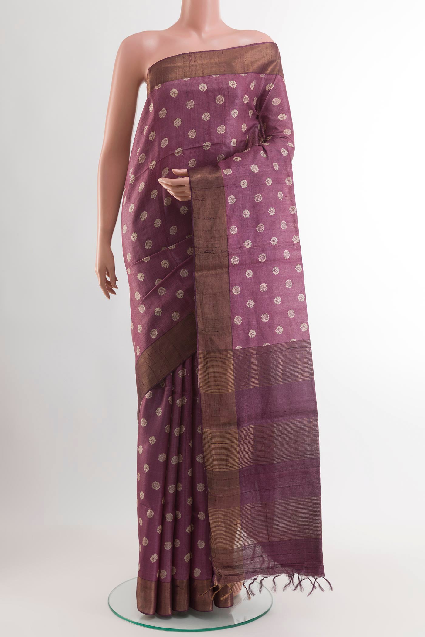 Purple Tussar Saree with Printed design on the body and Zari Border.  displayed on a mannequin