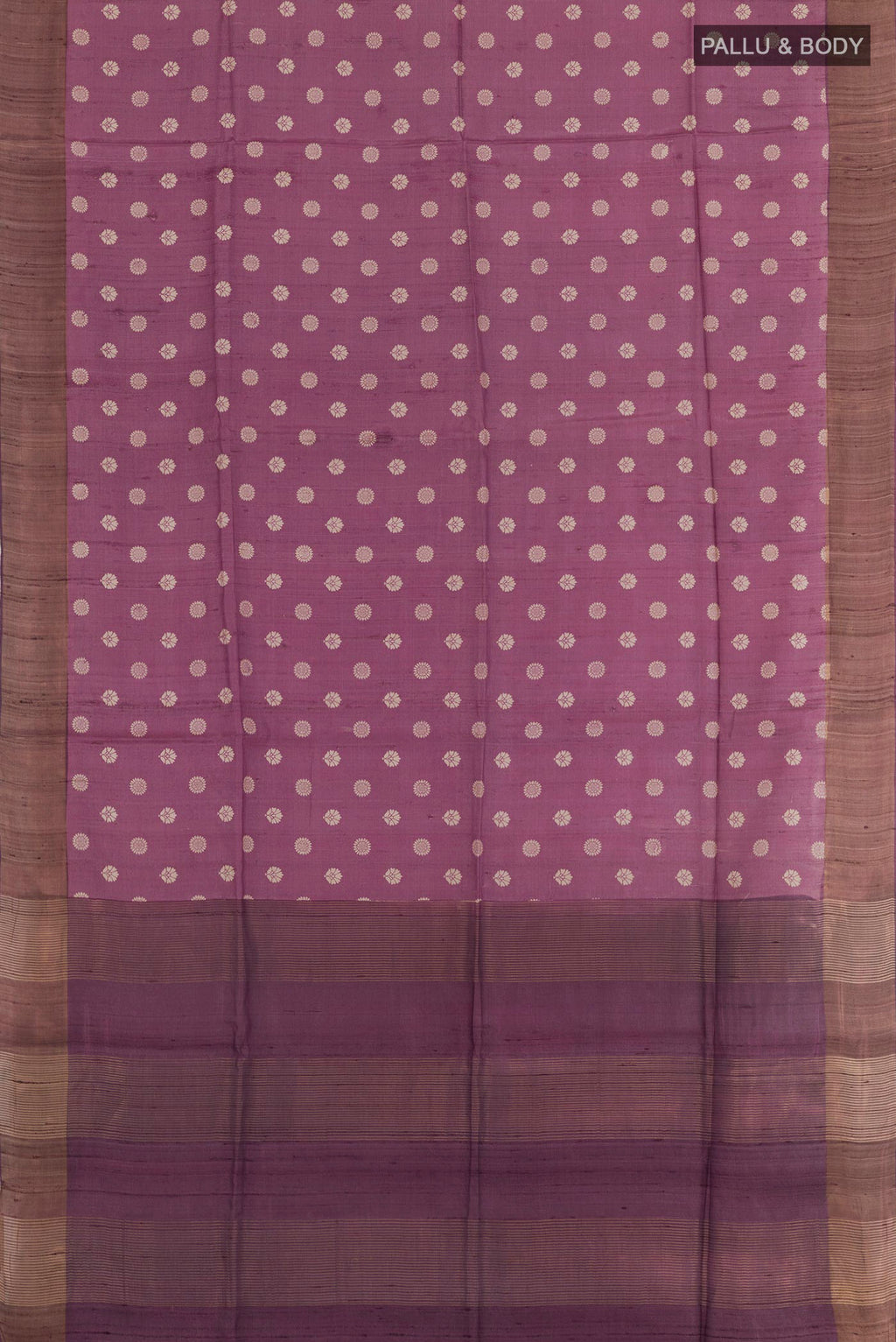 Flat view of Purple Tussar Saree with Printed design on the body and Zari Border. 