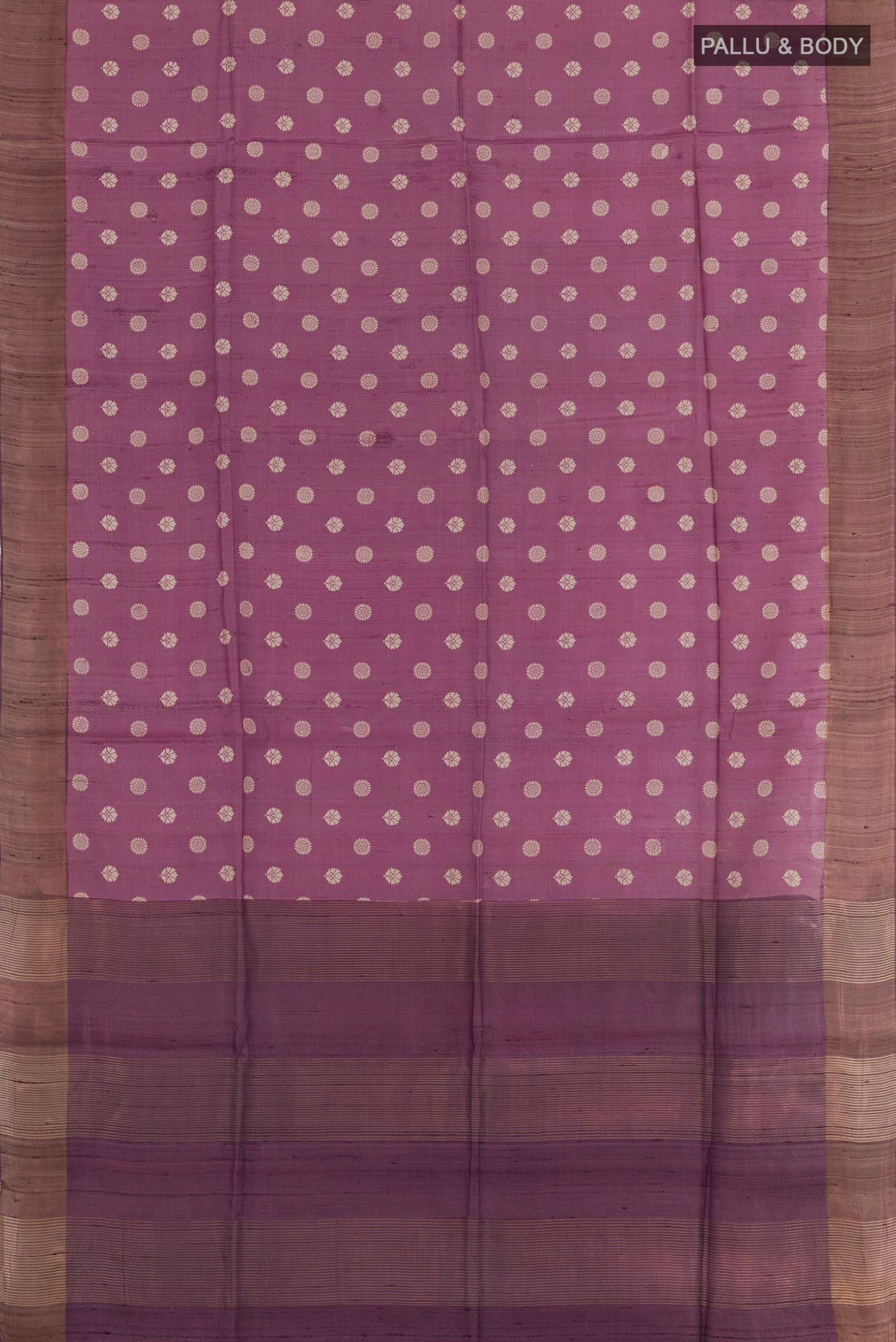 Flat view of Purple Tussar Saree with Printed design on the body and Zari Border. 