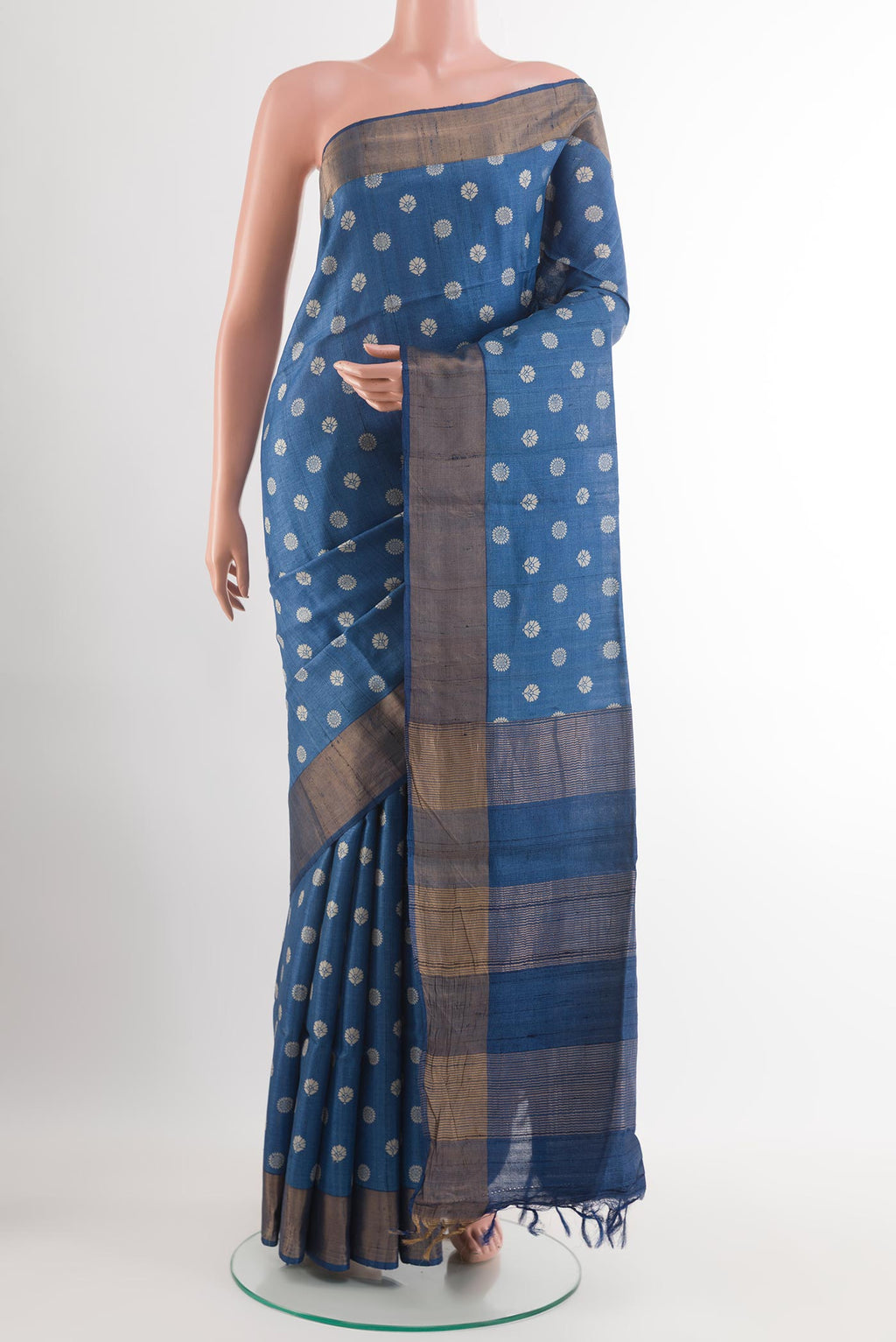 Blue Tussar Saree with Printed design on the body and Zari Border.  displayed on a mannequin