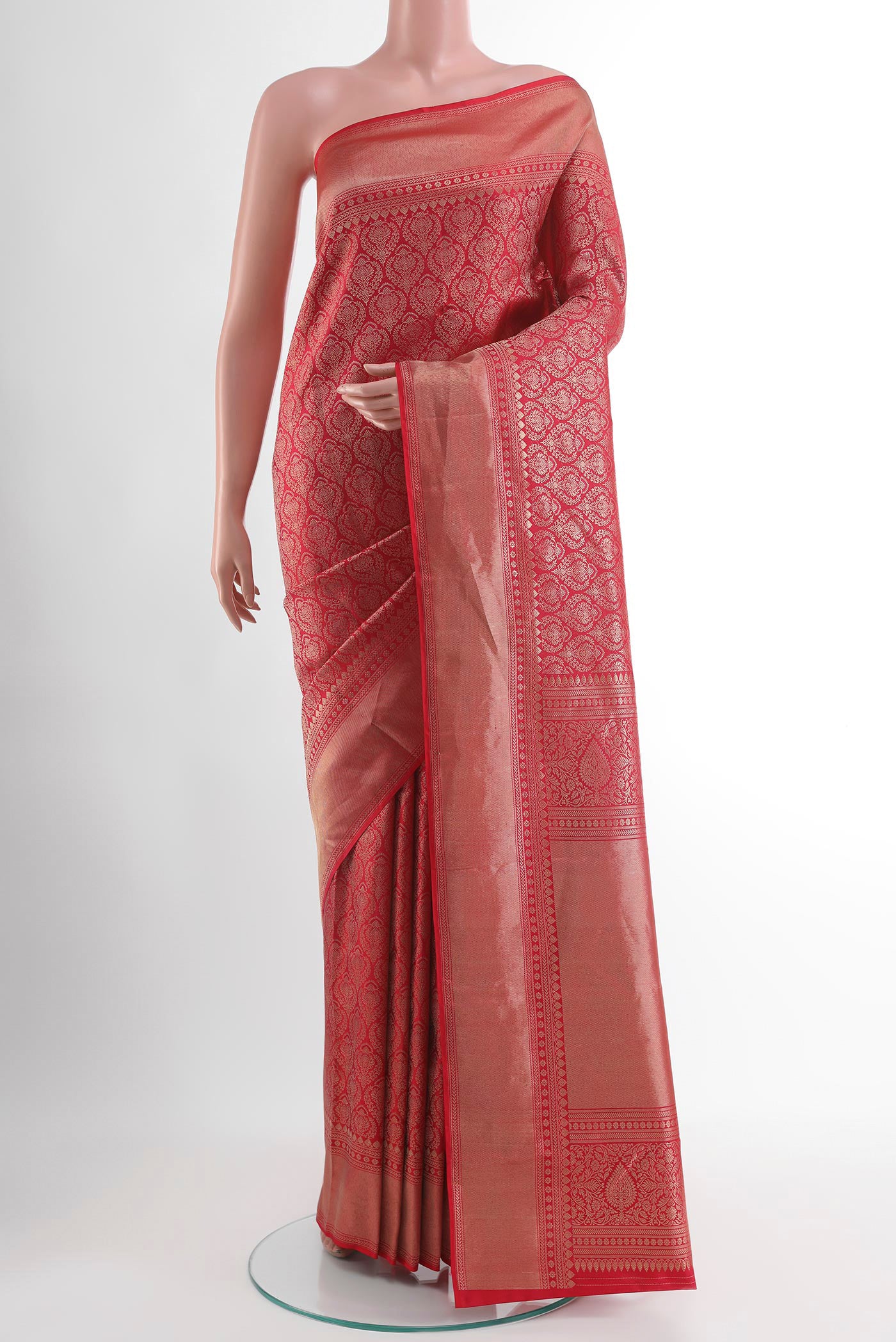 Red Kanchipuram Silk Saree with Zari Butta on the body and Zari Border.  displayed on a mannequin