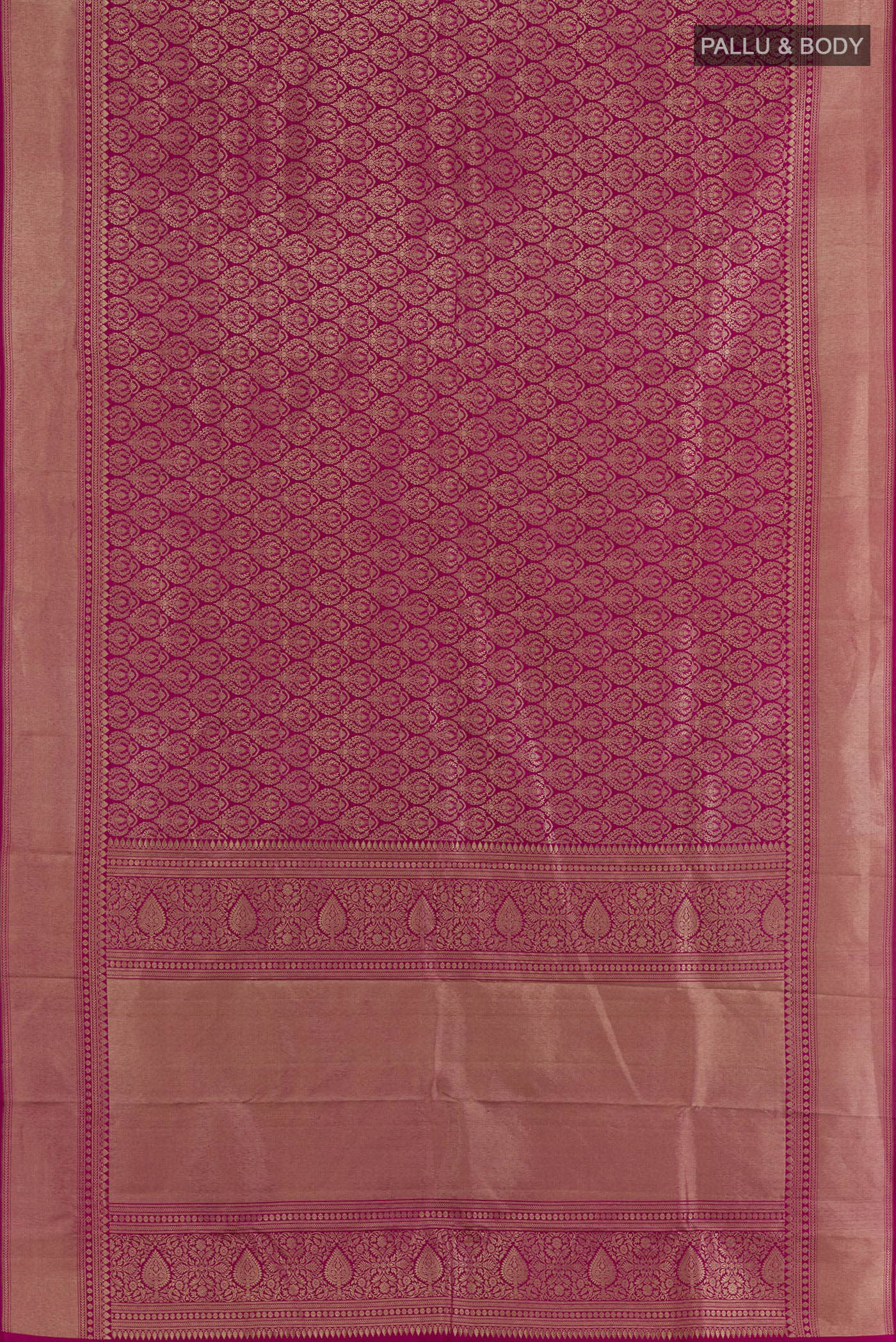 Flat view of Rani Pink Kanchipuram Silk Saree with Zari Butta on the body and Zari Border. 