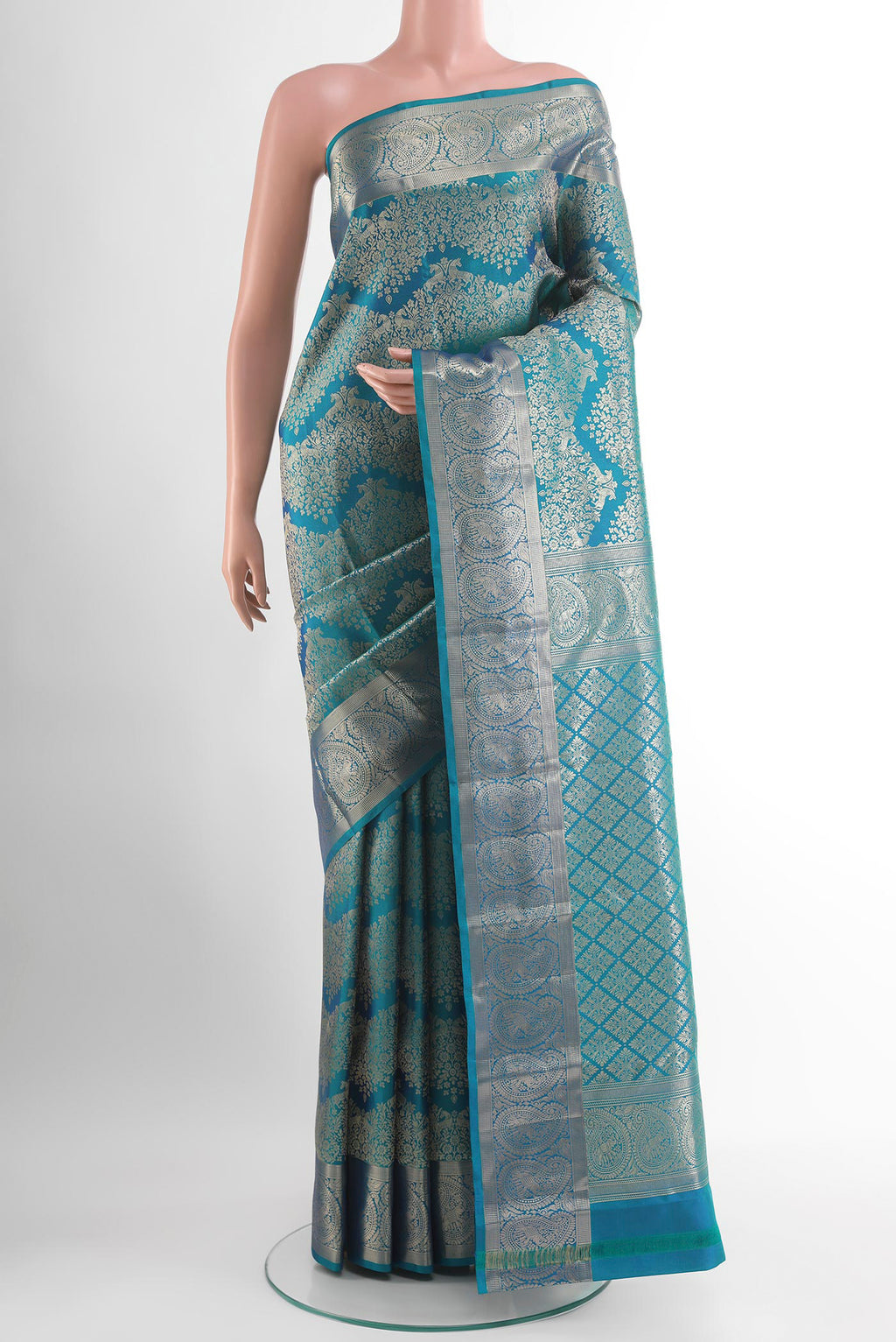 Blue Kanjivaram Silk Saree with Zari Brocade on the body and Zari Border.  displayed on a mannequin