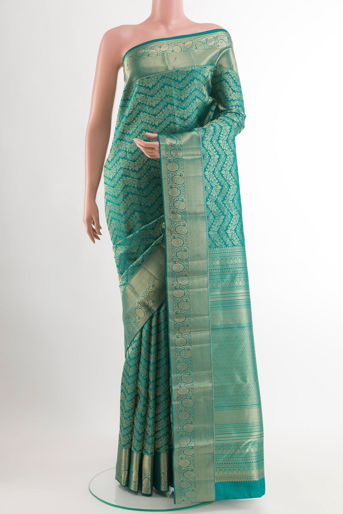 Sea Green Kanchipuram Silk Saree with Zari Brocade on the body and Zari Border.  displayed on a mannequin