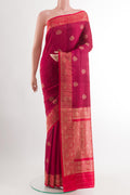 Maroon Banarasi Tussar Silk Saree with Zari Butta on the body and Zari Border.  displayed on a mannequin