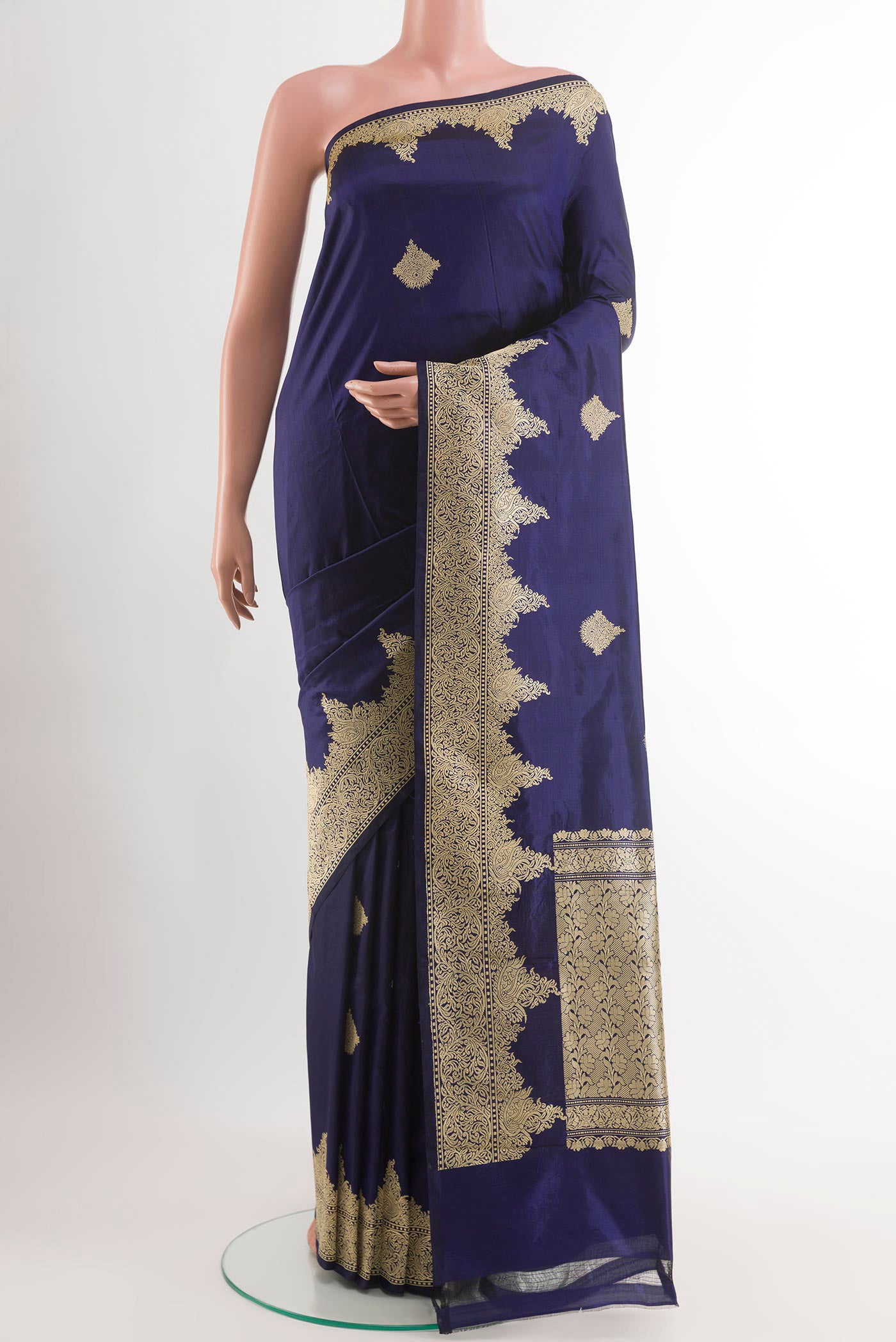 Blue Banarasi Katan Silk Saree with Zari Butta on the body and Zari Border.  displayed on a mannequin