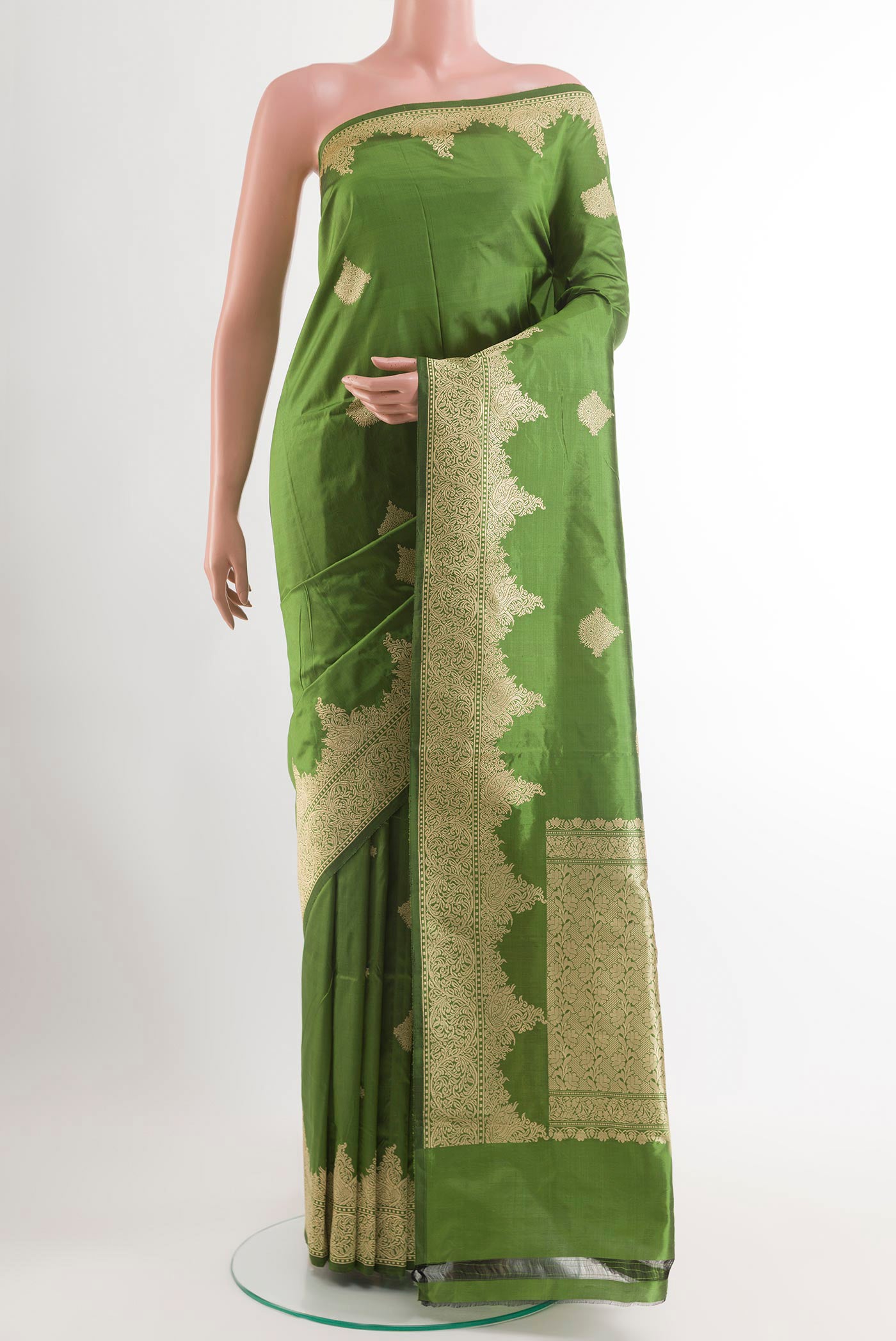 Green Banarasi Katan Silk Saree with Zari Butta on the body and Zari Border.  displayed on a mannequin