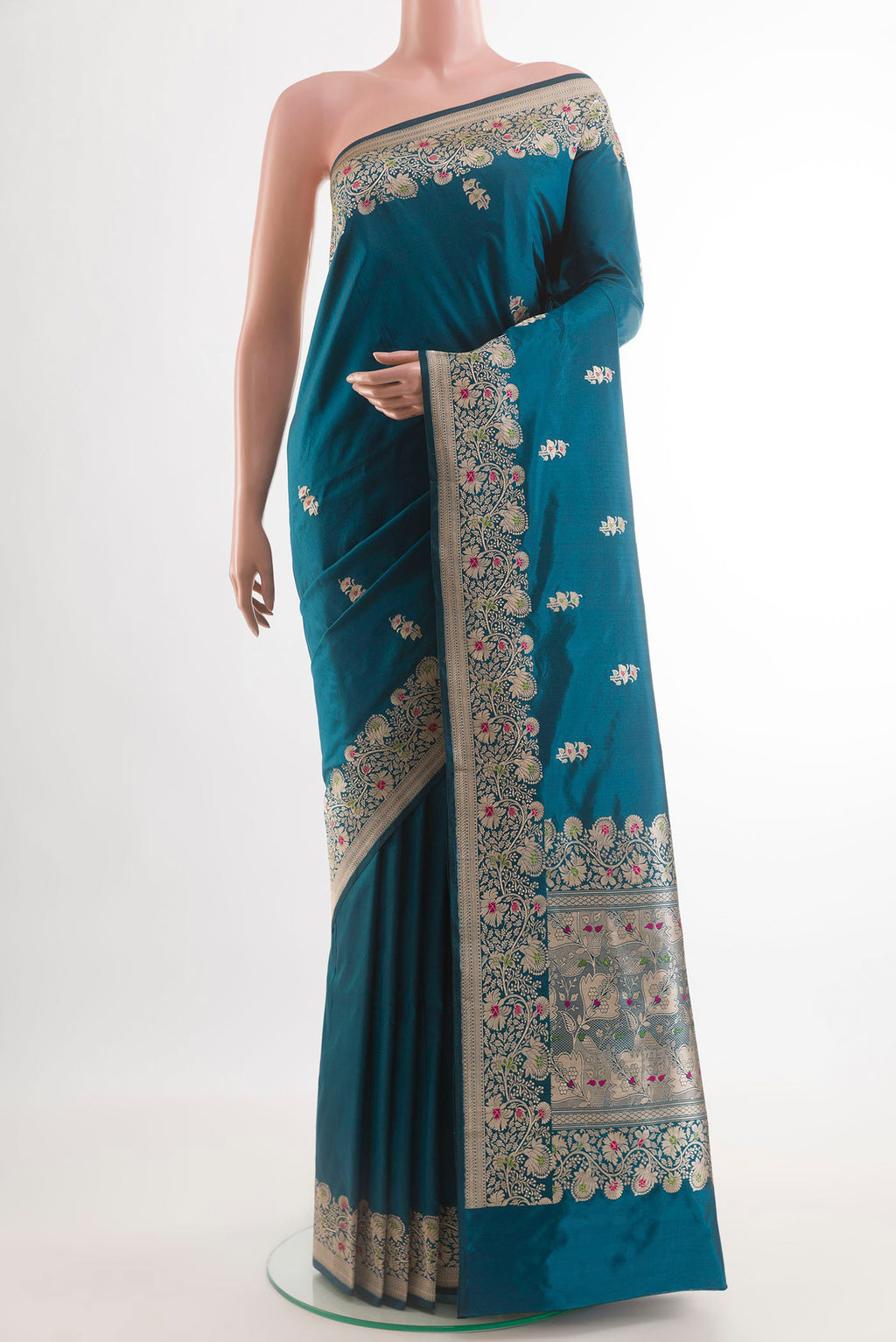Blue Banarasi Katan Silk Saree with Zari Butta on the body and Zari Border.  displayed on a mannequin