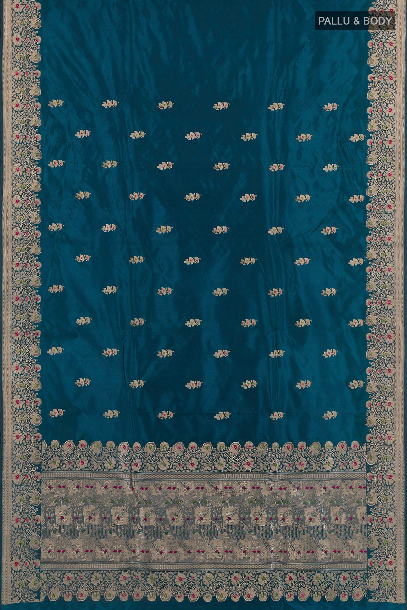 Flat view of Blue Banarasi Katan Silk Saree with Zari Butta on the body and Zari Border. 