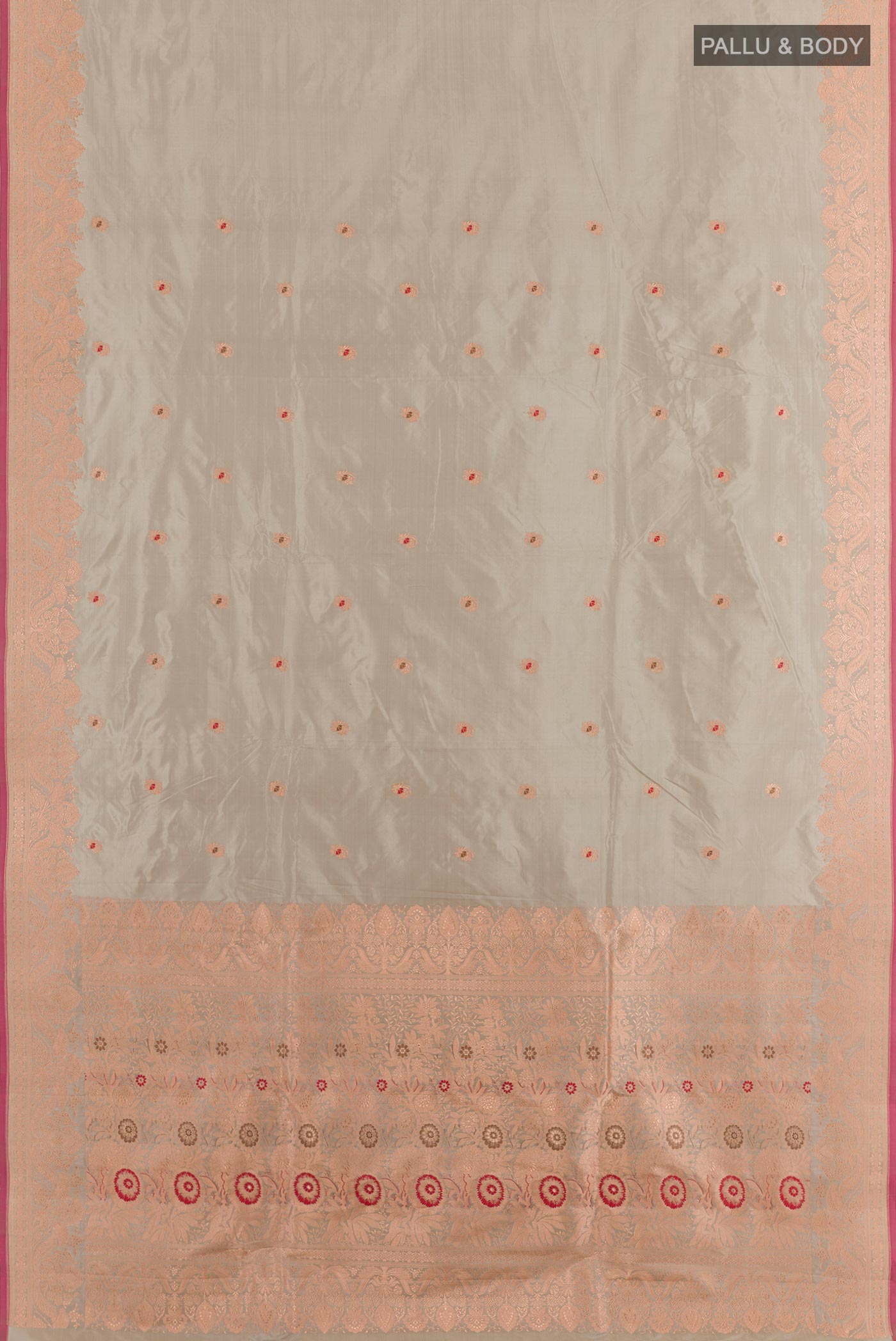 Flat view of Grey Banarasi Katan Silk Saree with Zari Butta on the body and Zari Border. 