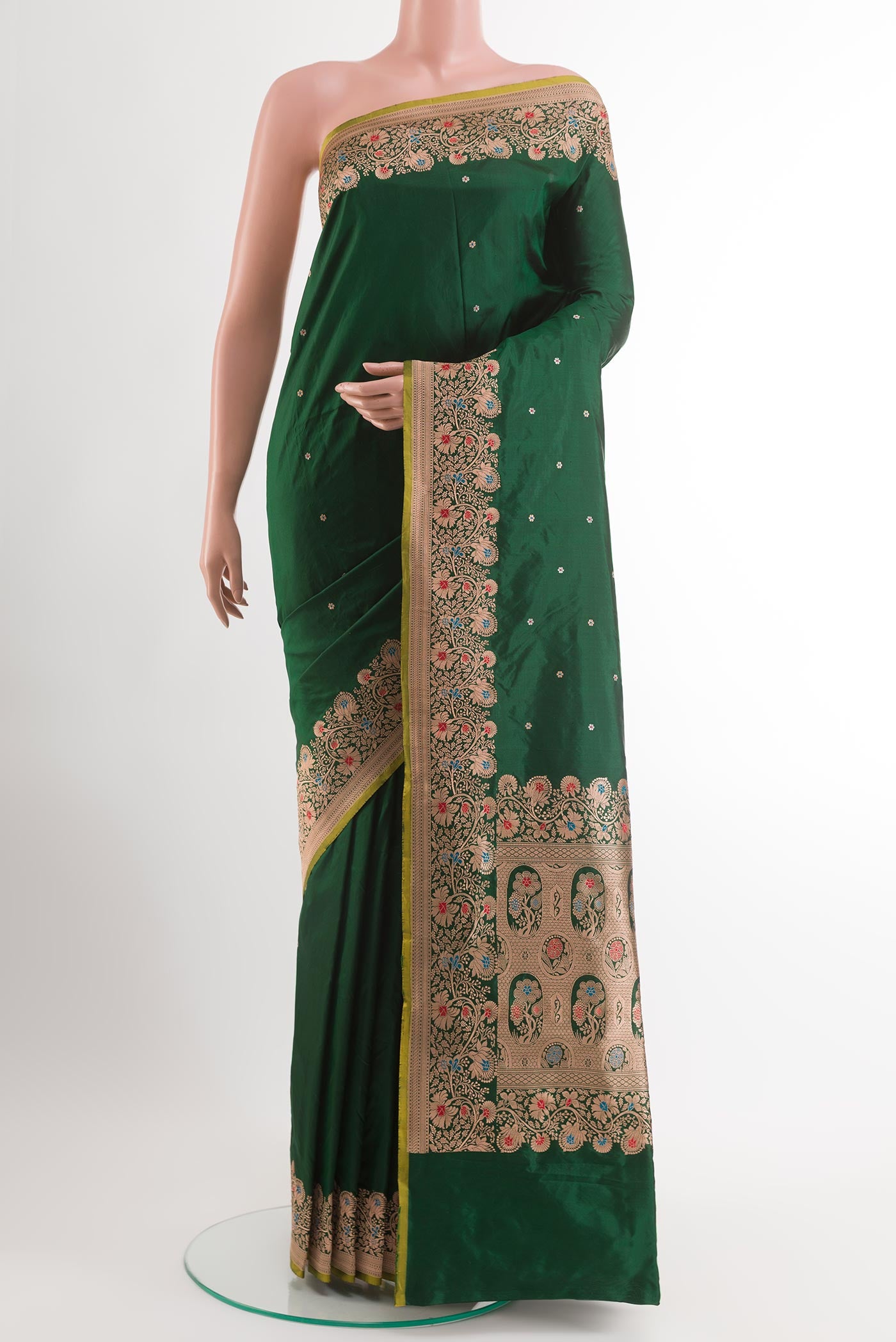 Bottle Green Banarasi Katan Silk Saree with Zari Butta on the body and Zari Border.  displayed on a mannequin