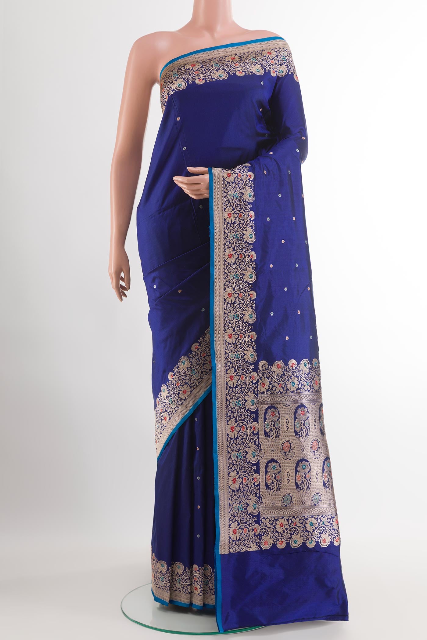 Blue Banarasi Katan Silk Saree with Zari Butta on the body and Zari Border.  displayed on a mannequin