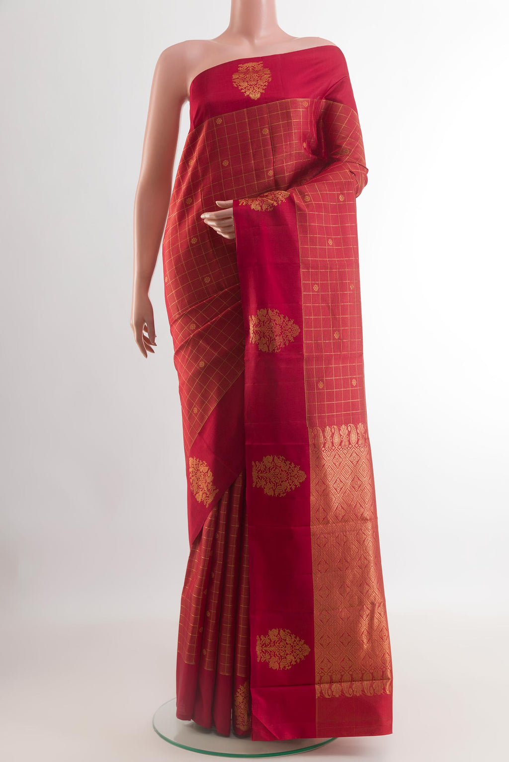Red Kanjivaram Silk Saree with Checked design on the body and Zari Border.  displayed on a mannequin