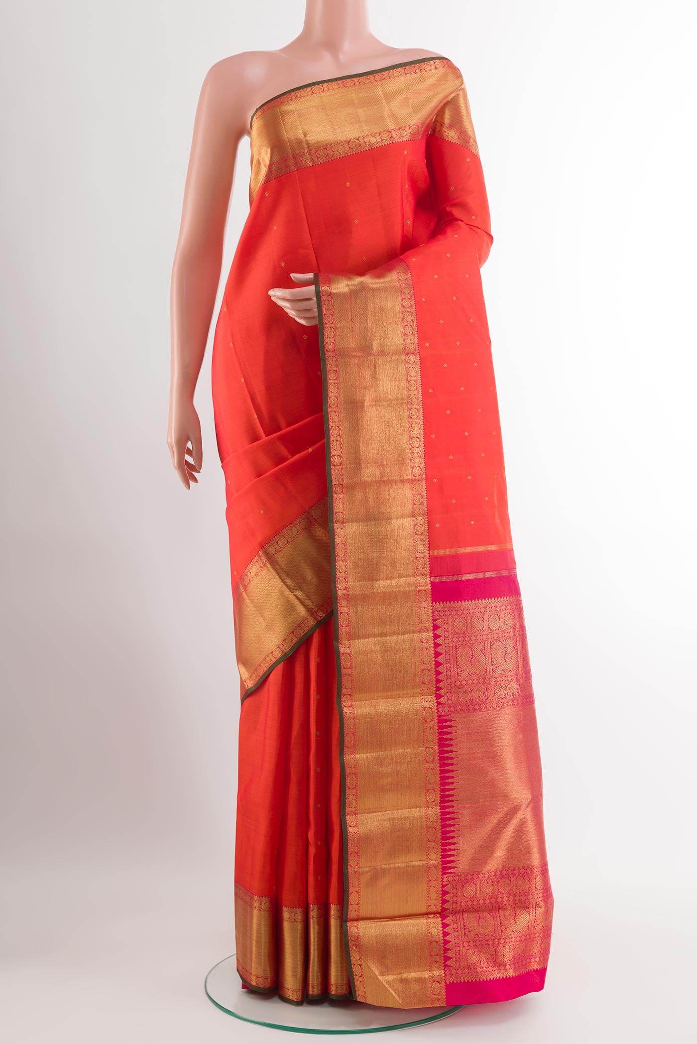 Pure Silk Pure Zari Orange Kanjivaram Saree with Zari Butta on the body and Zari Border.  displayed on a mannequin