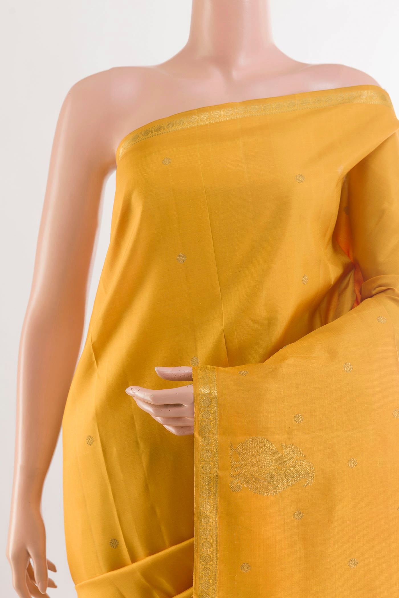 Border image of Yellow Kanchipuram Silk Saree with Zari Butta on the body and Zari Border. 