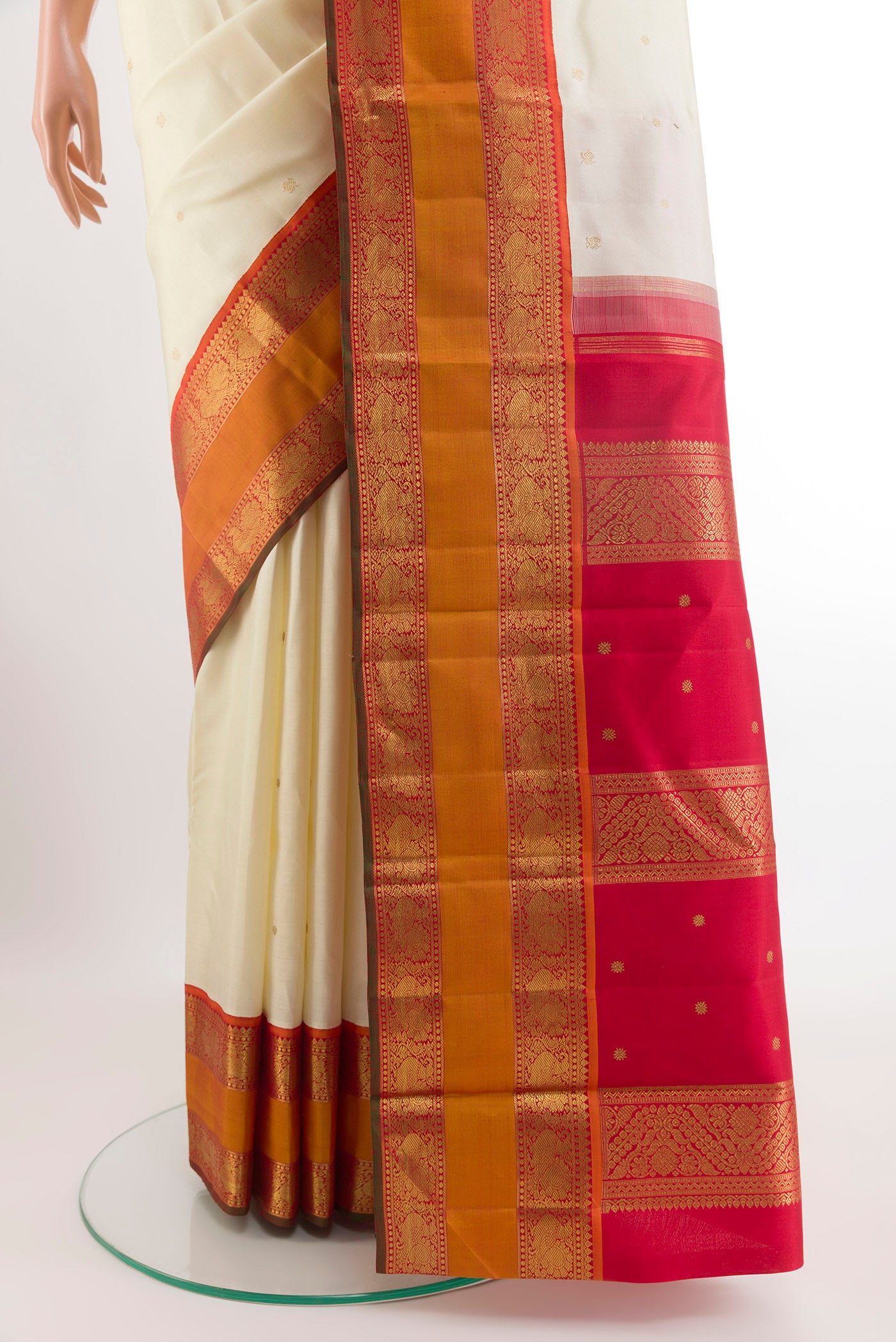Pleats and pallu of Off White Kanjivaram Silk Saree with Zari Butta on the body and Zari Border. 