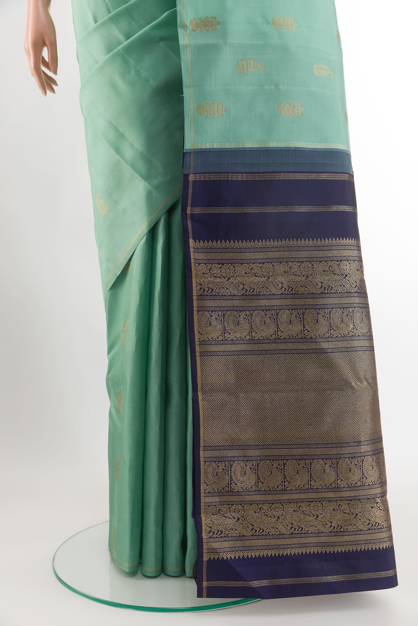 Pleats and pallu of Pure Silk Pure Zari Light Blue Kanchipuram Saree with Zari Butta on the body and Zari Border. 