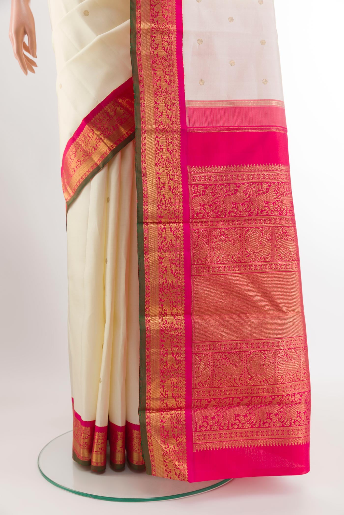 Pleats and pallu of Pure Silk Pure Zari Off White Kanjivaram Saree with Zari Butta on the body and Zari Border. 