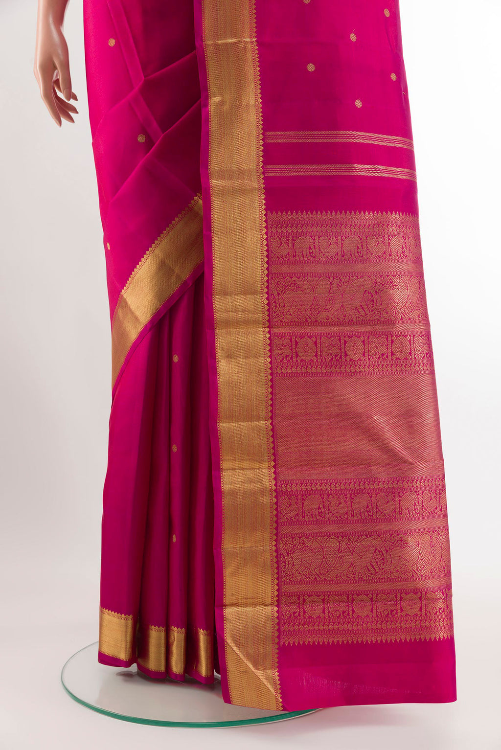 Pleats and pallu of Rani Pink Dual Tone Kanjivaram Silk Saree with Zari Butta on the body and Zari Border. 