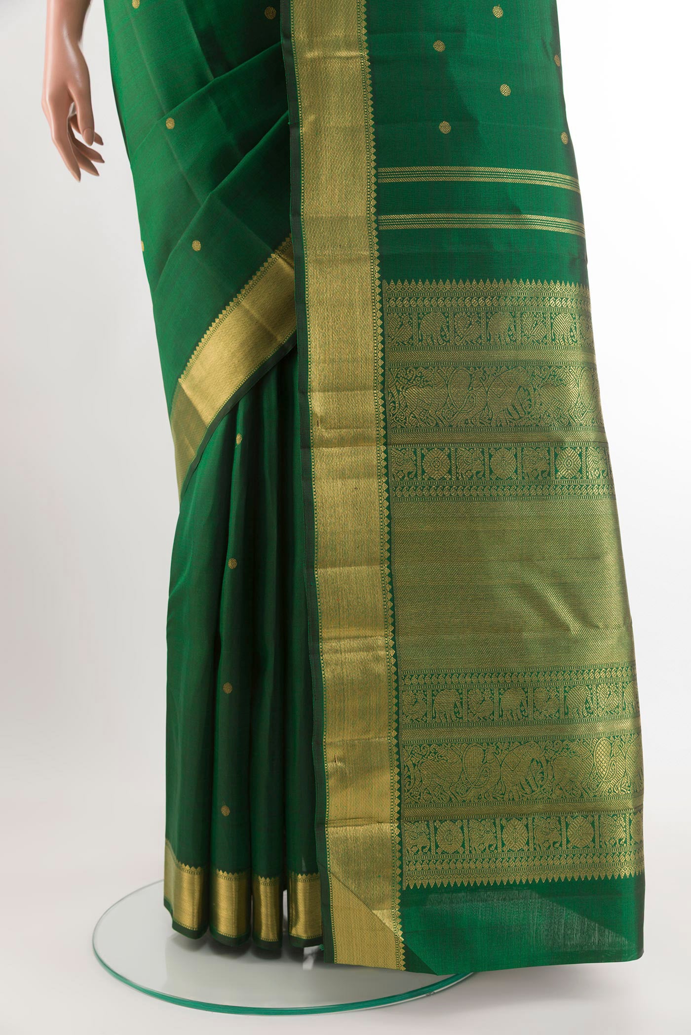 Pleats and pallu of Green Kanjivaram Silk Saree with Zari Butta on the body and Zari Border. 