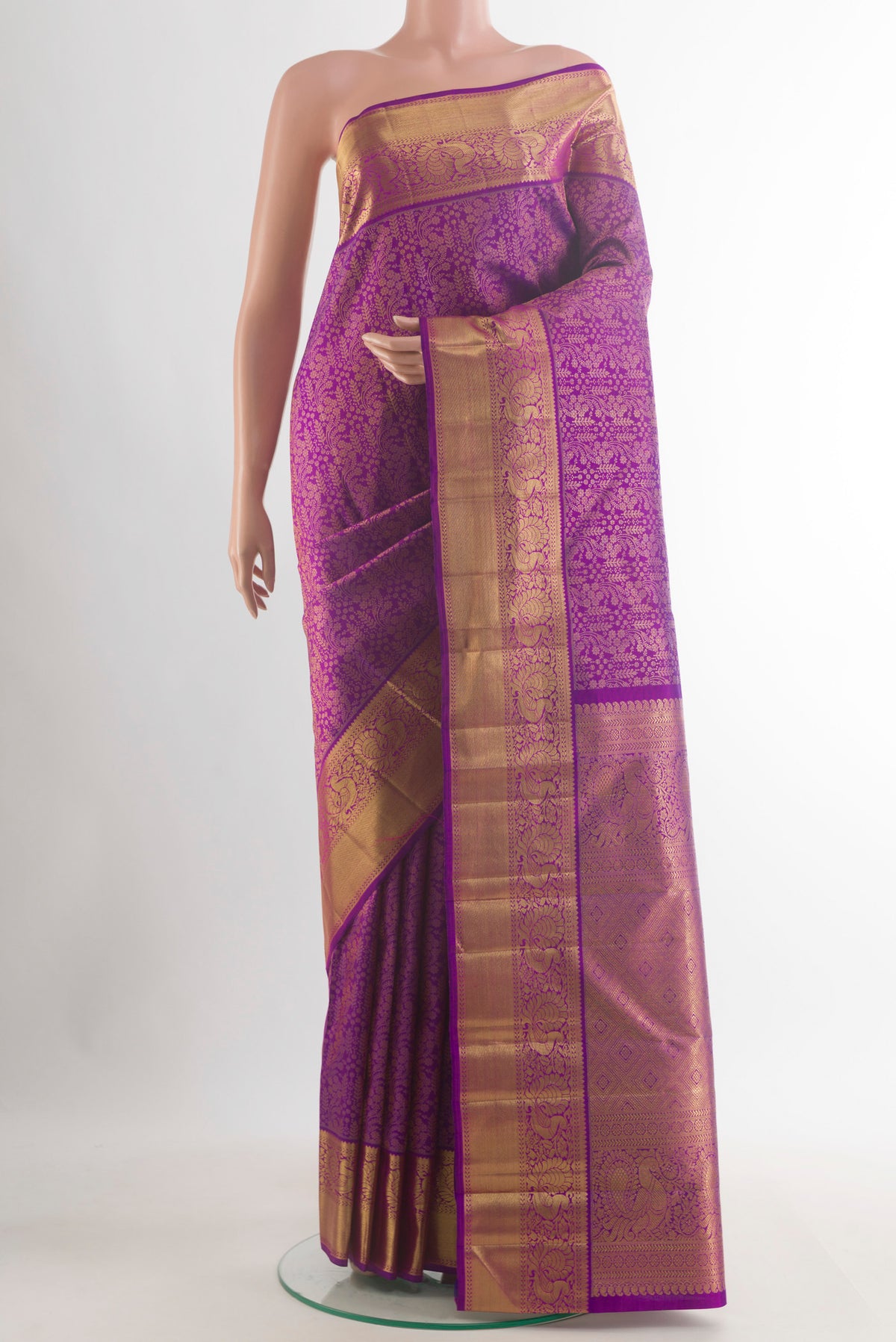 Pure Silk Pure Zari Purple Kanjivaram Saree with Zari Brocade on the body and Zari Border.  displayed on a mannequin