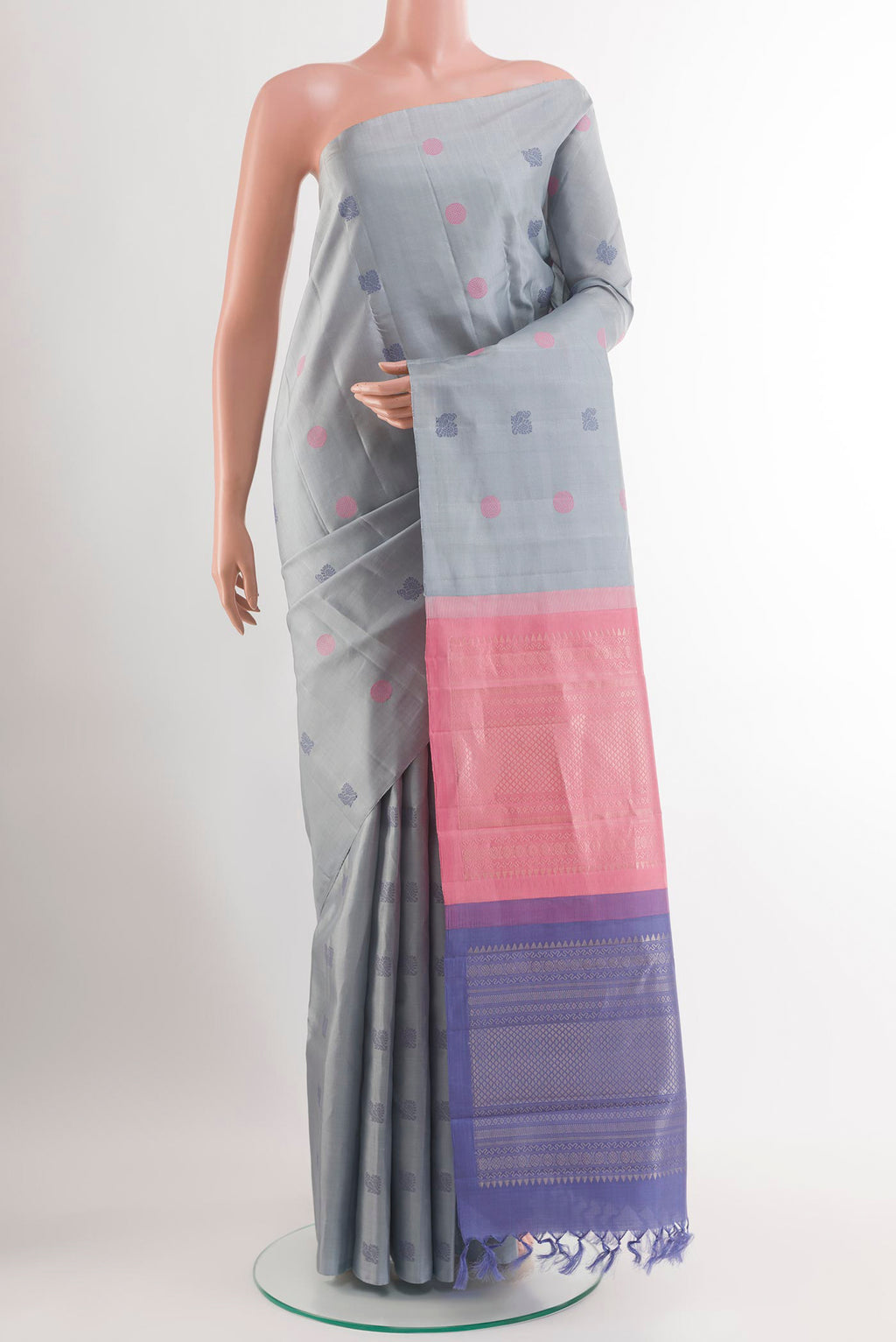 Blue Grey Kanchipuram Silk Saree with Thread Butta on the body and Zari Border.  displayed on a mannequin