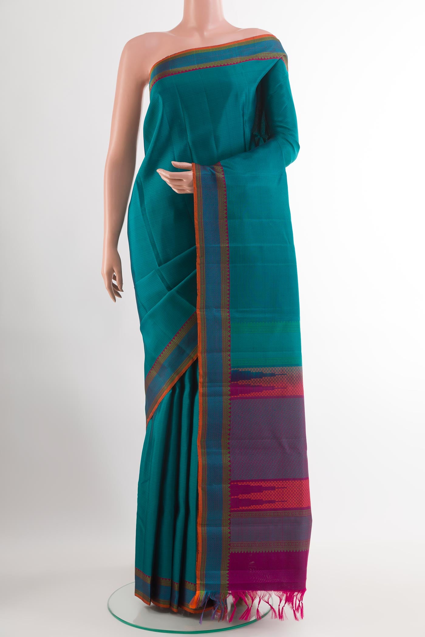 Blue Kanchipuram Silk Saree with Stripes on the body and Thread Embroidery Border.  displayed on a mannequin