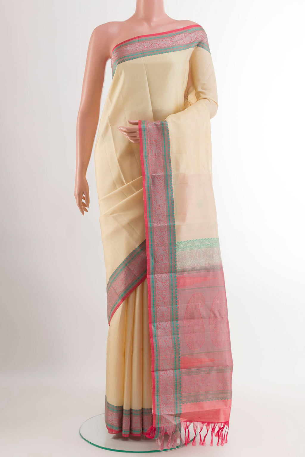Off White Kanchipuram Silk Saree with Plain Body and Thread Embroidery Border.  displayed on a mannequin