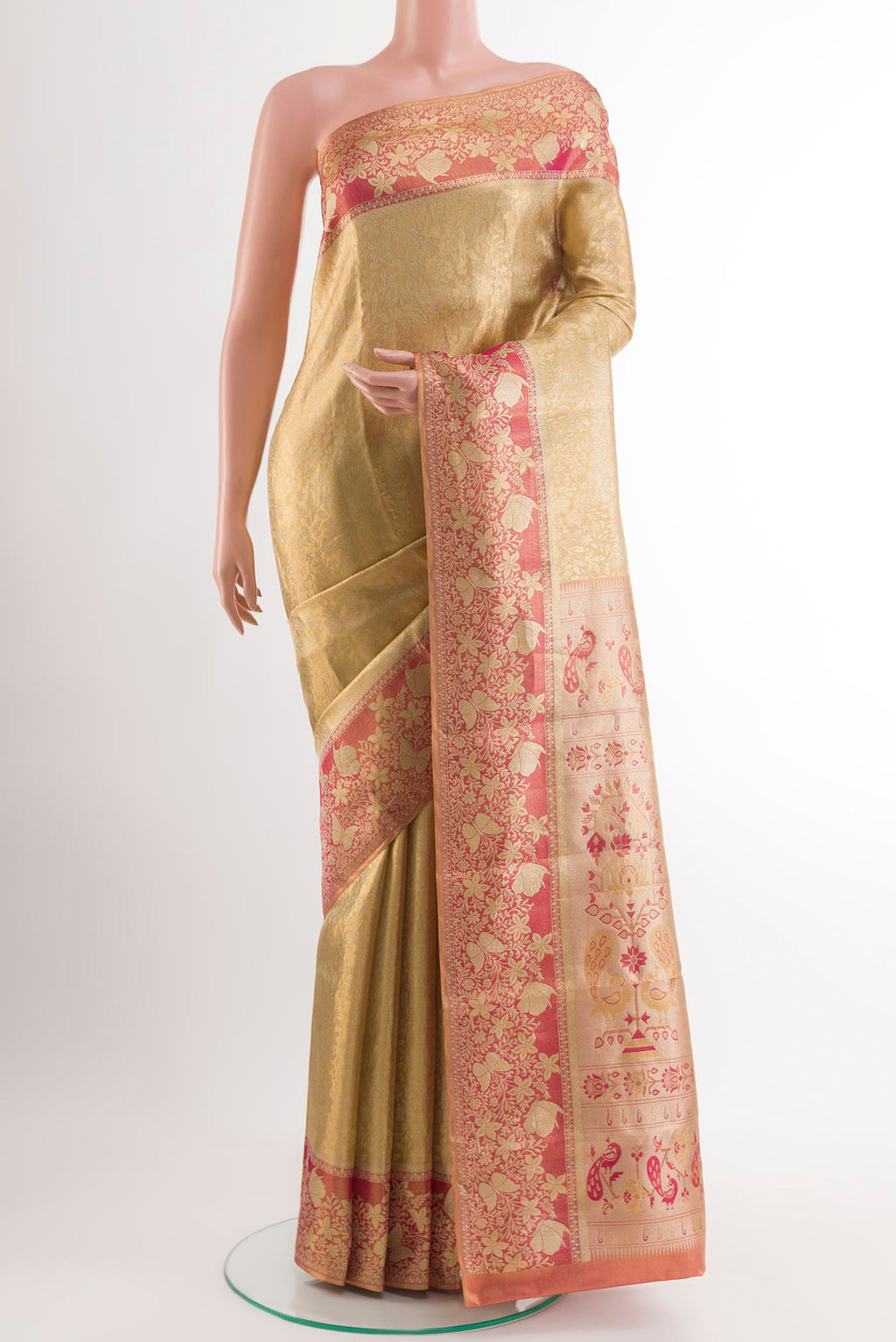 Golden Kanjivaram Silk Saree with Zari Brocade on the body and Zari Border.  displayed on a mannequin