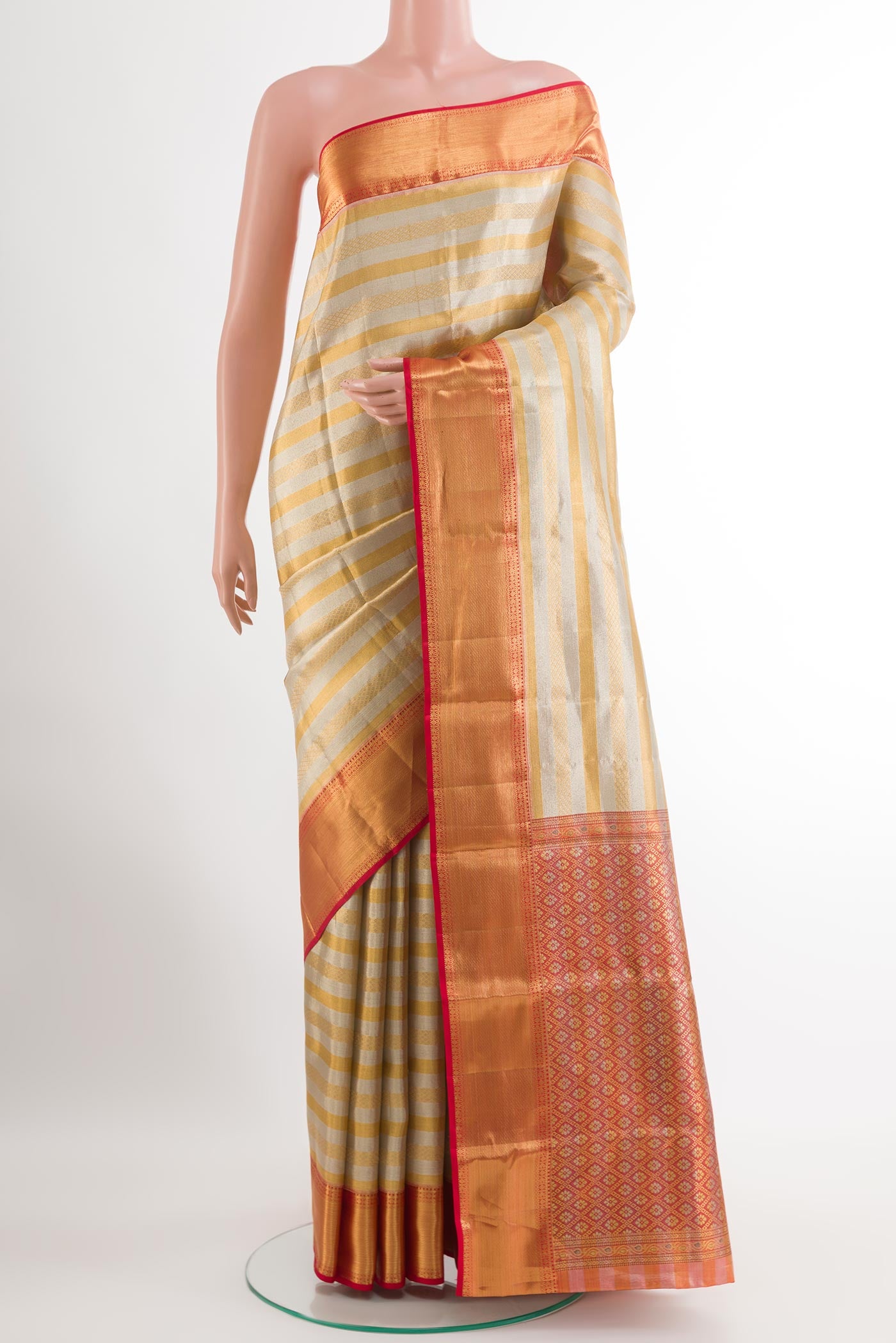Silver Kanjivaram Silk Saree with Stripes on the body and Zari Border.  displayed on a mannequin