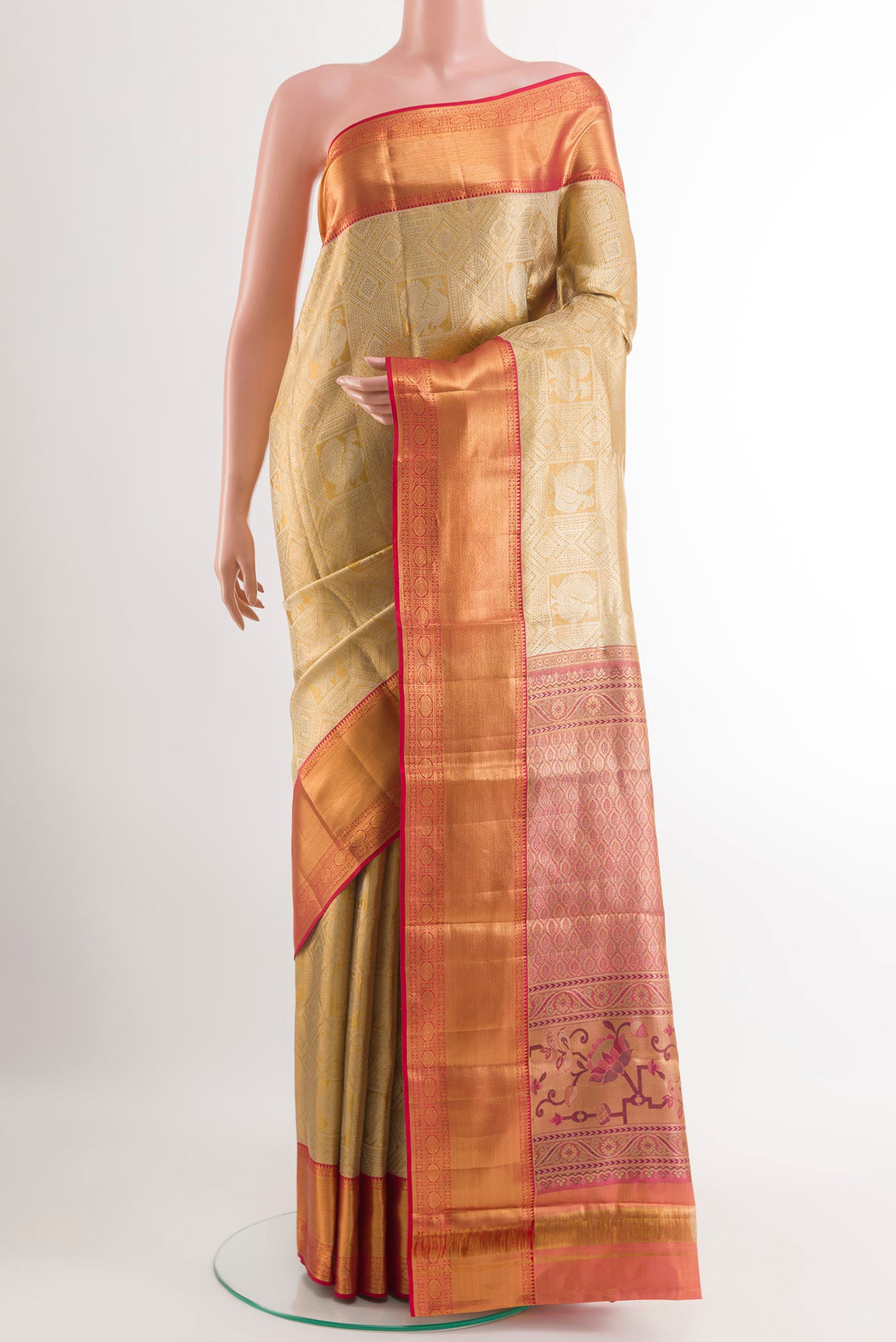 Golden Kanjivaram Silk Saree with Zari Brocade on the body and Zari Border.  displayed on a mannequin