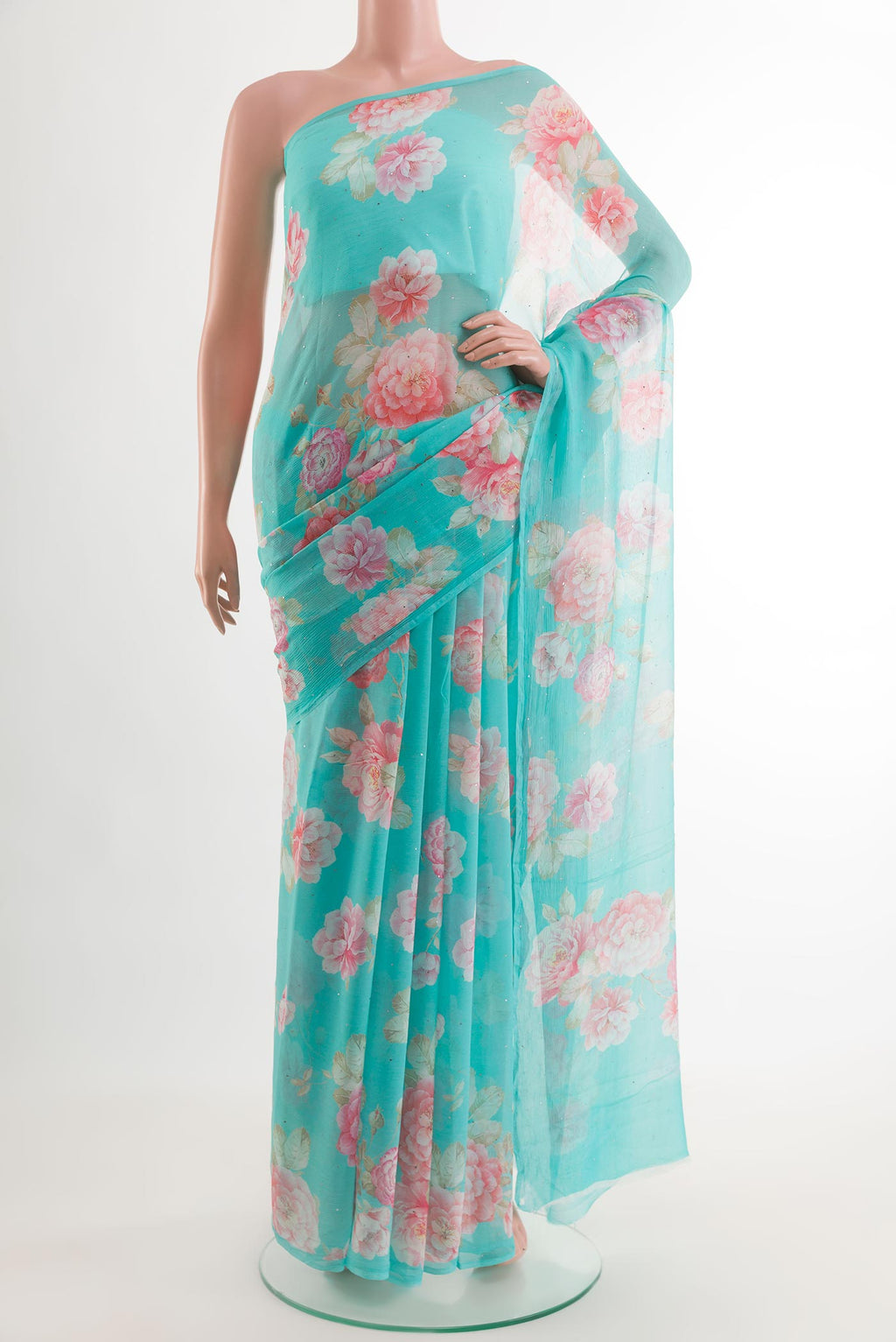 Blue Chiffon Saree with Printed design on the body and Plain Border.  displayed on a mannequin