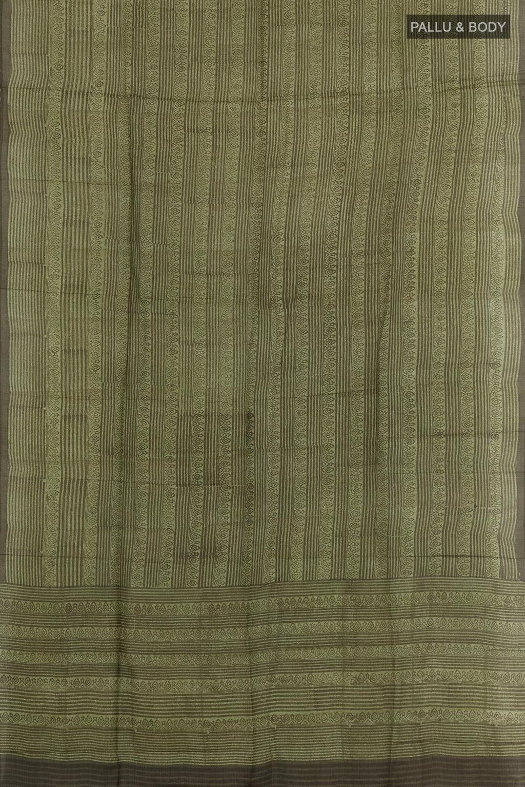 Flat view of Green Tussar Saree with Printed design on the body and Printed Border. 