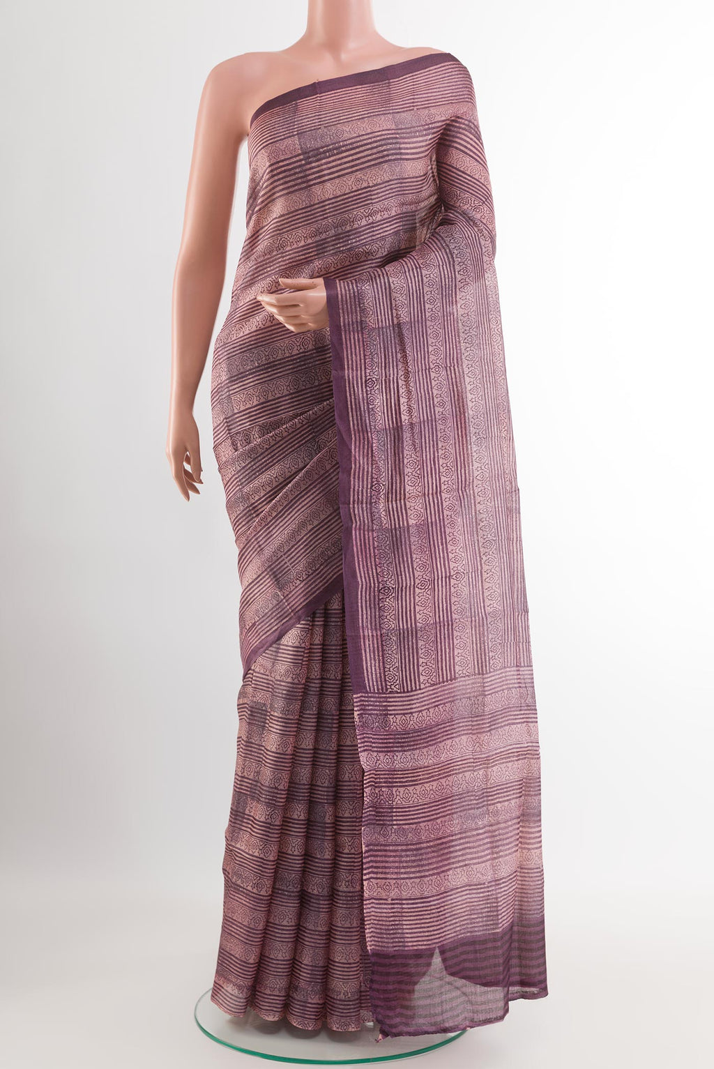 Purple Tussar Saree with Printed design on the body and Printed Border.  displayed on a mannequin