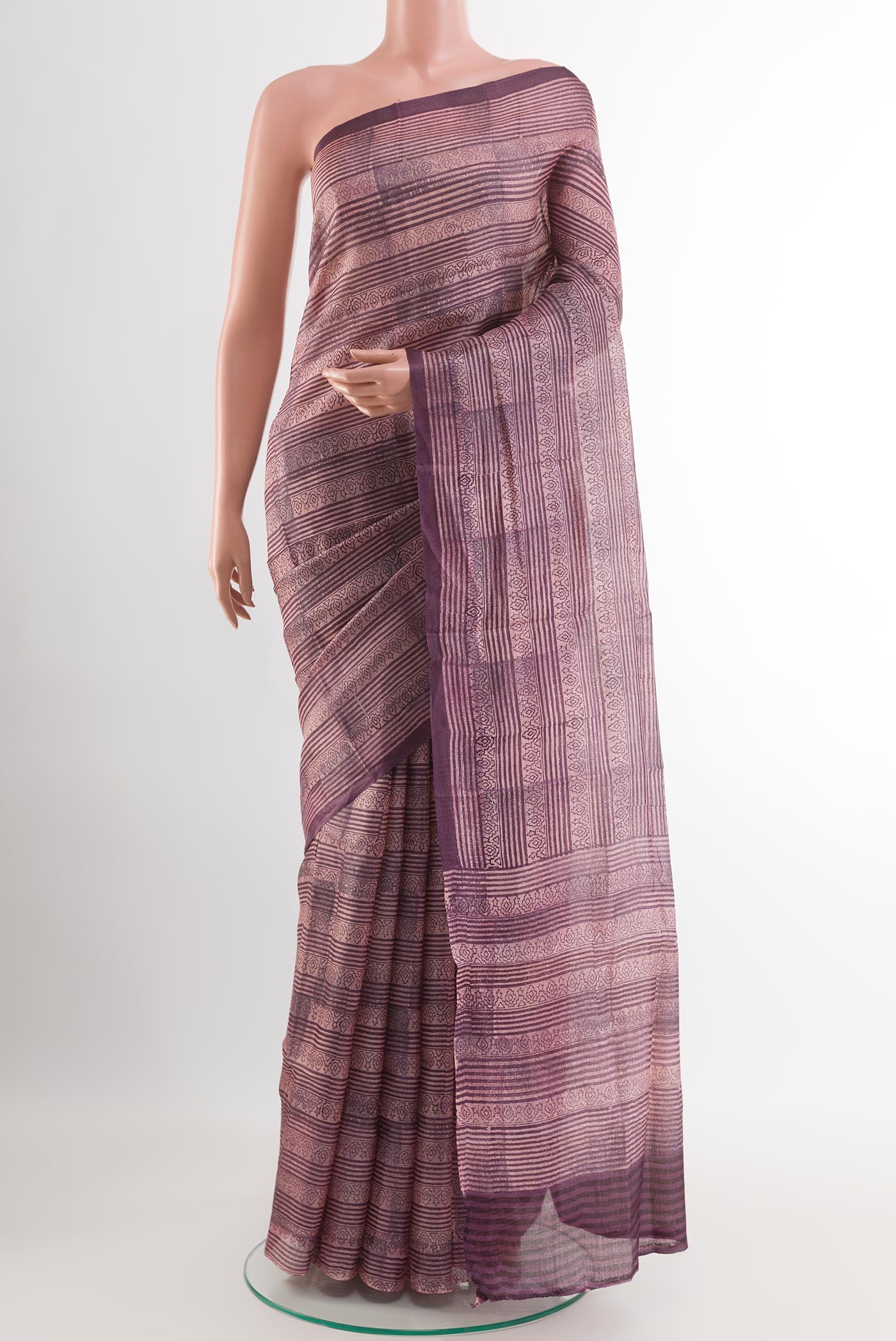 Purple Tussar Saree with Printed design on the body and Printed Border.  displayed on a mannequin