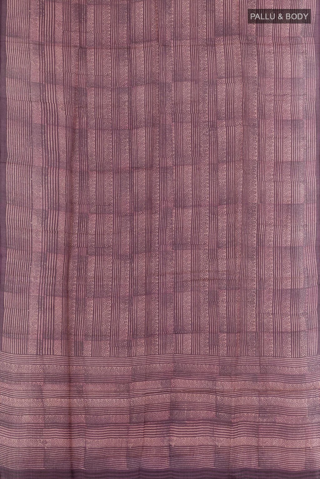 Flat view of Purple Tussar Saree with Printed design on the body and Printed Border. 
