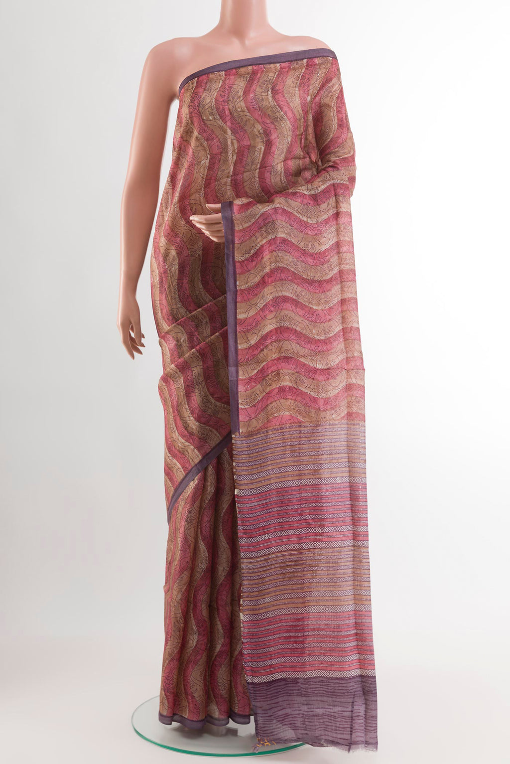 Purple Tussar Saree with Printed design on the body and Zari Border.  displayed on a mannequin