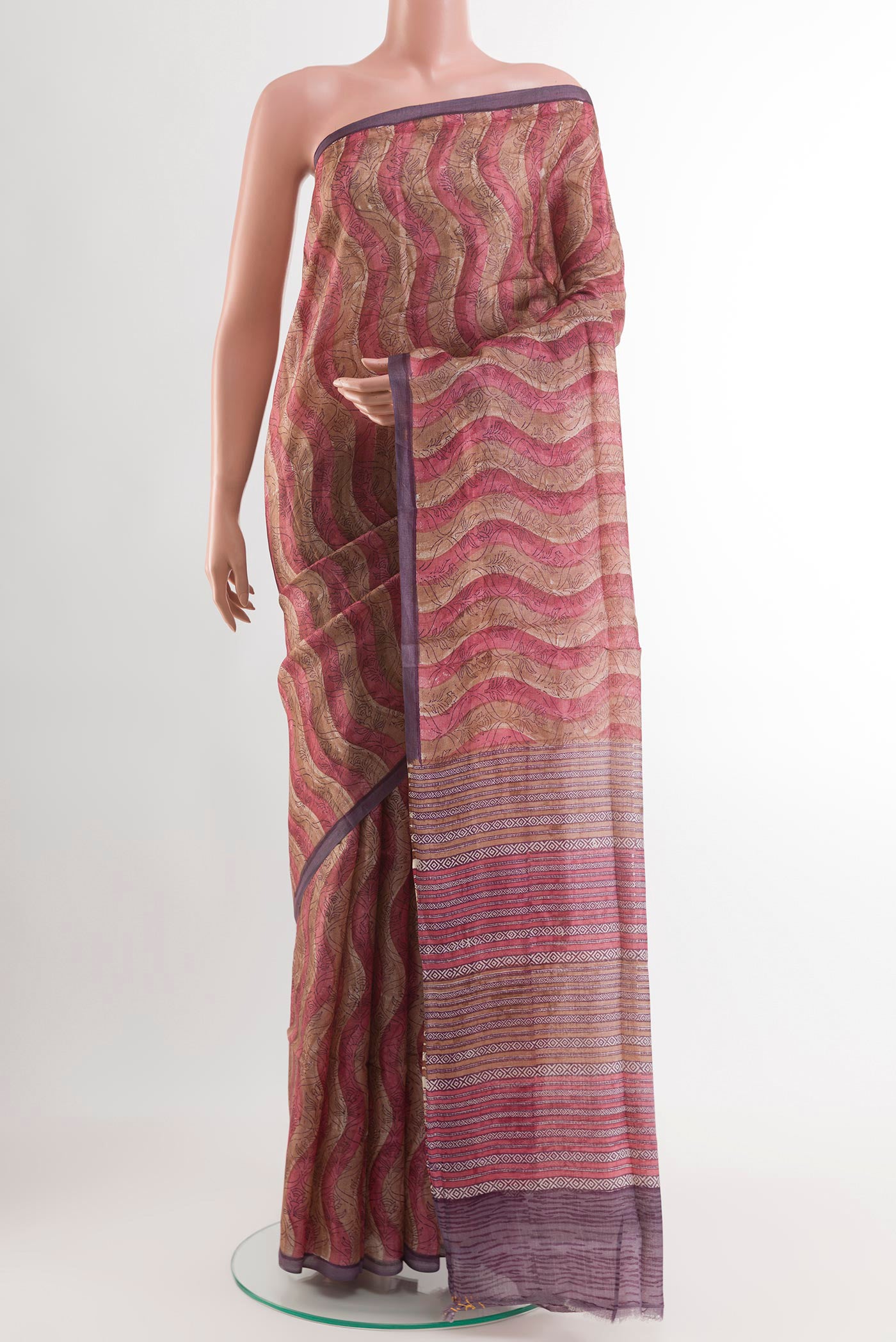 Purple Tussar Saree with Printed design on the body and Zari Border.  displayed on a mannequin