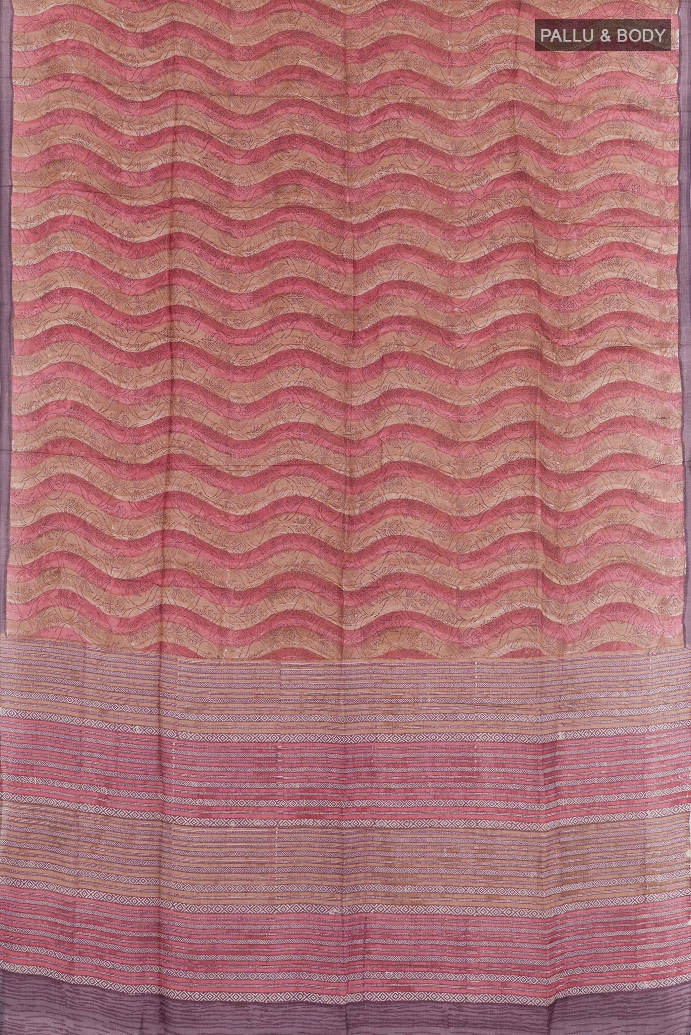 Flat view of Purple Tussar Saree with Printed design on the body and Zari Border. 