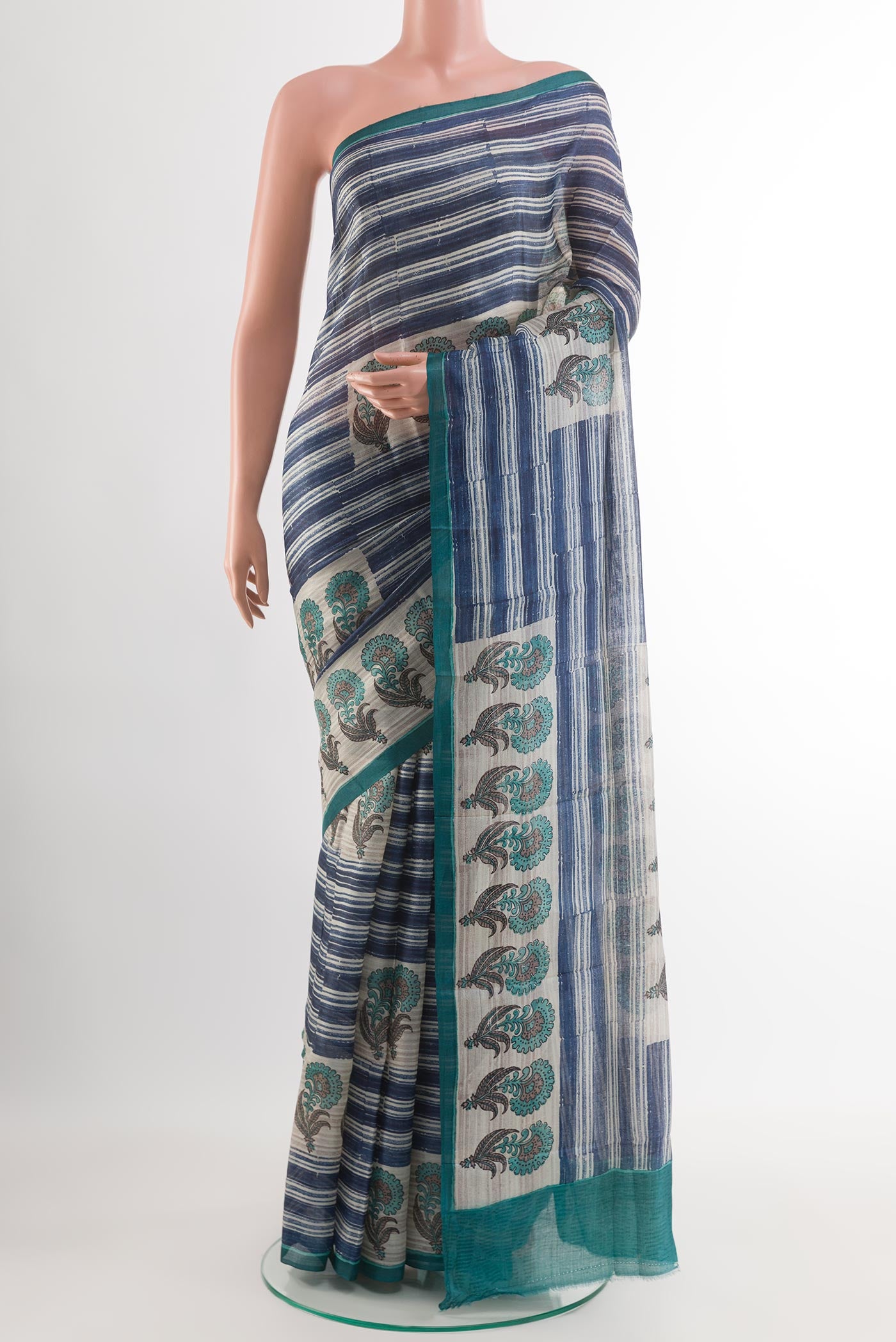 Blue Tussar Saree with Printed design on the body and Printed Border.  displayed on a mannequin