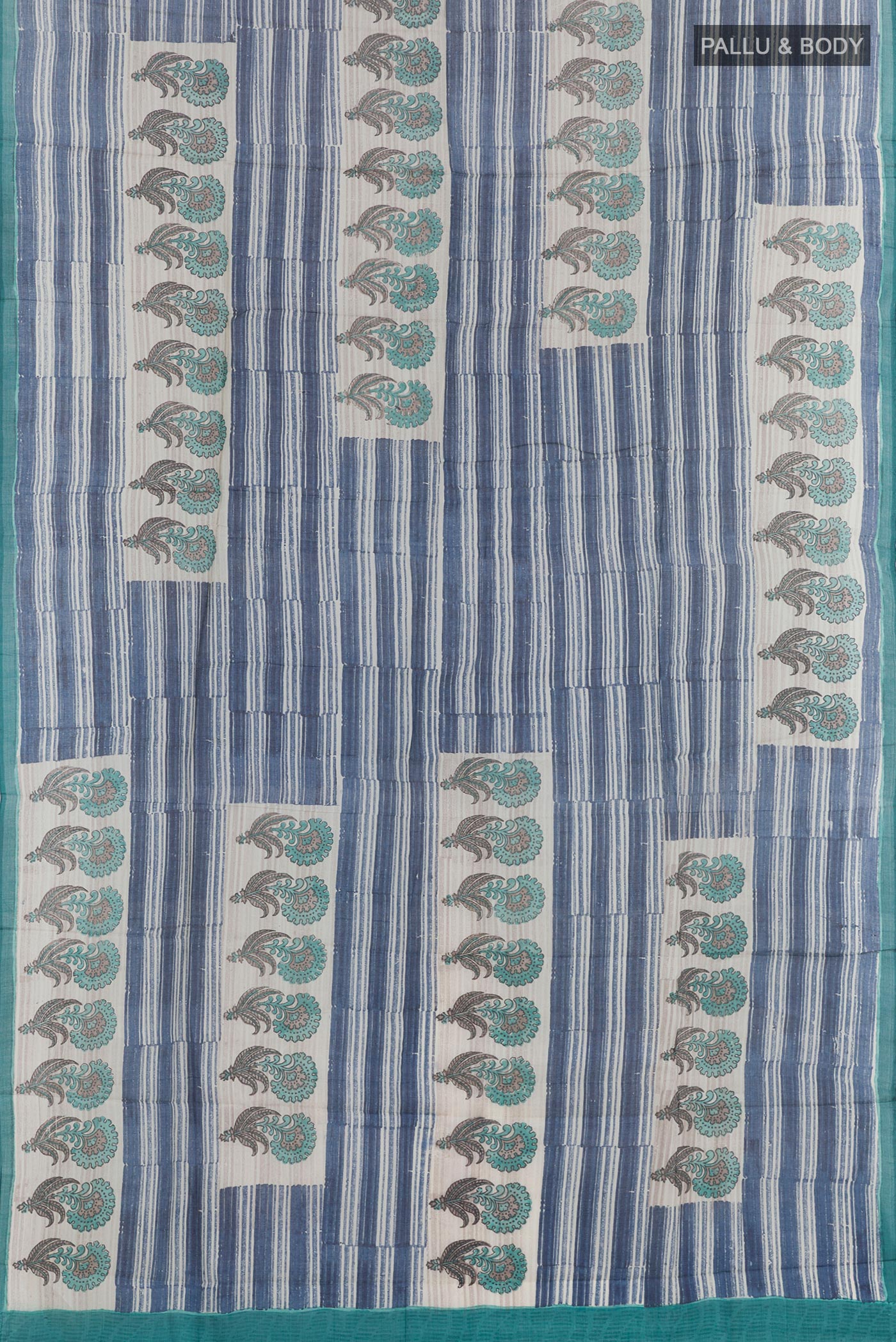 Flat view of Blue Tussar Saree with Printed design on the body and Printed Border. 